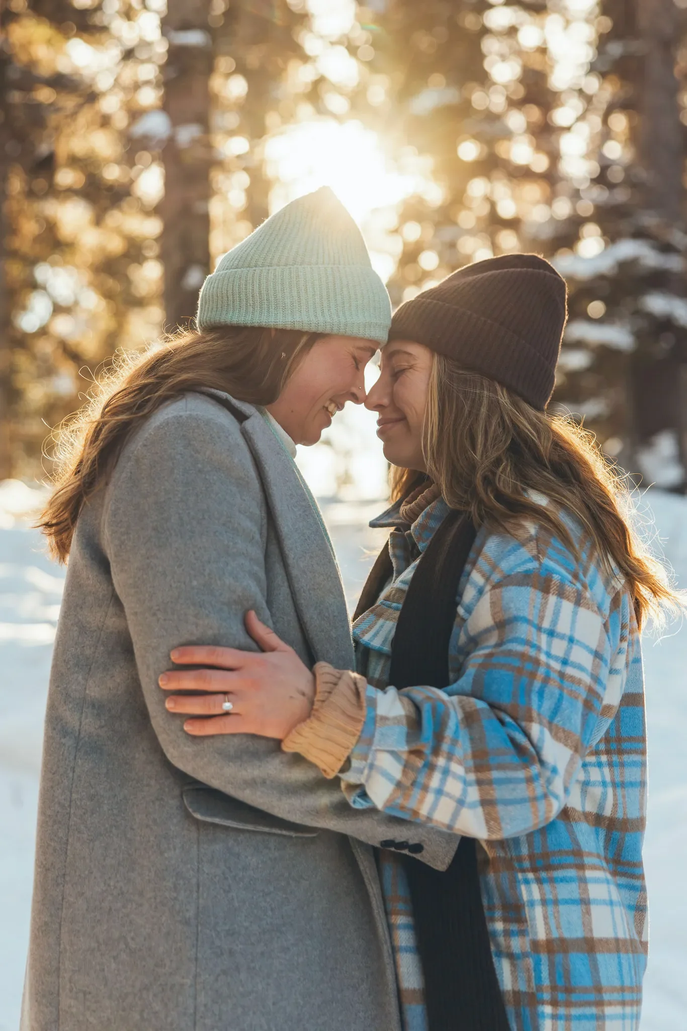 137_couple-engagement-winter-forest-golden-hour.webp