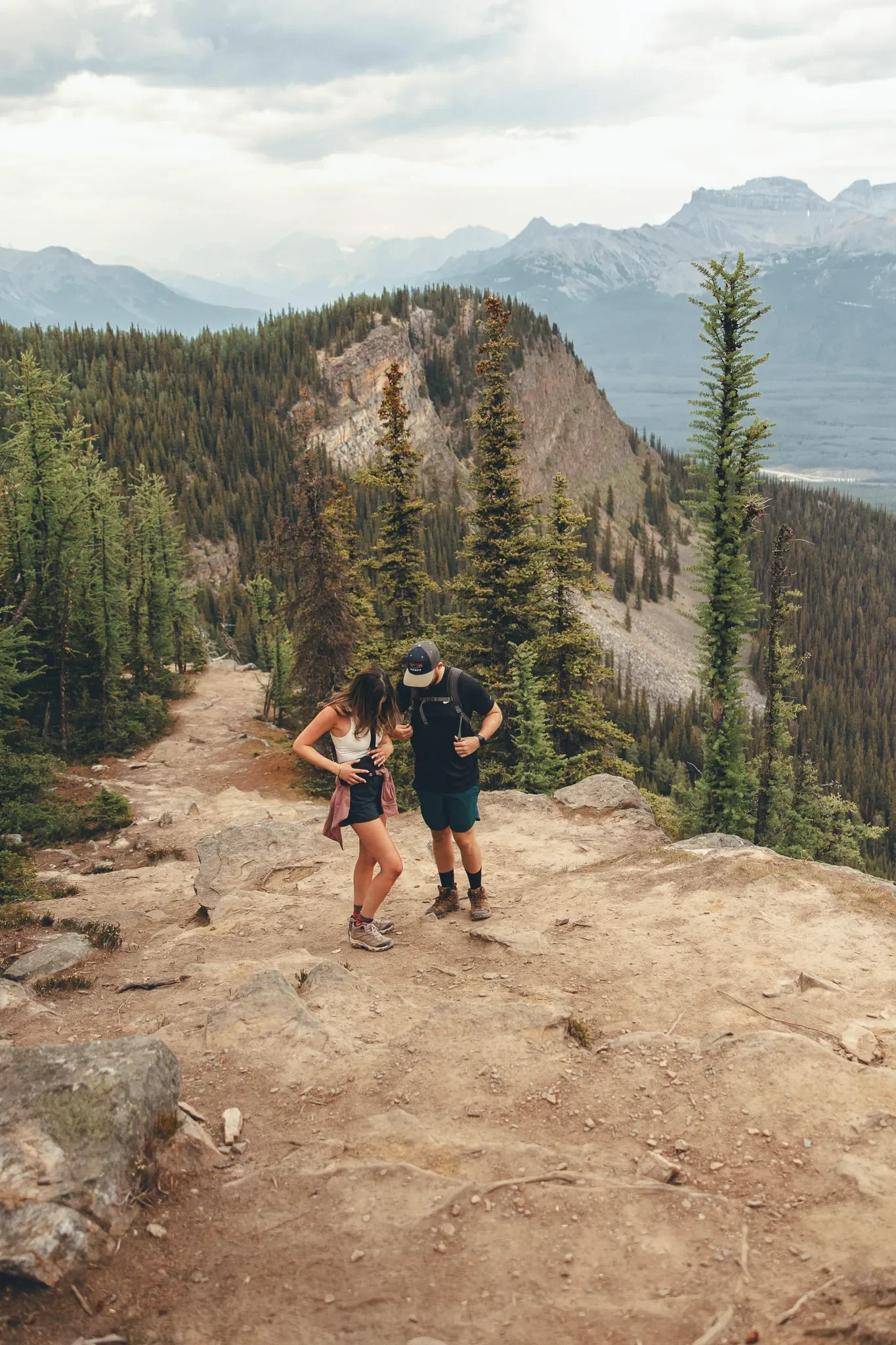 143_Couple-Hiking-Mountain-Trail-Canadian-Rockies-Viewpoint.webp