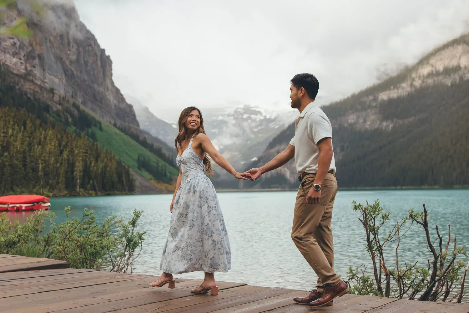 121_couple-walking-lake-louise-banff-mountain-landscape.webp