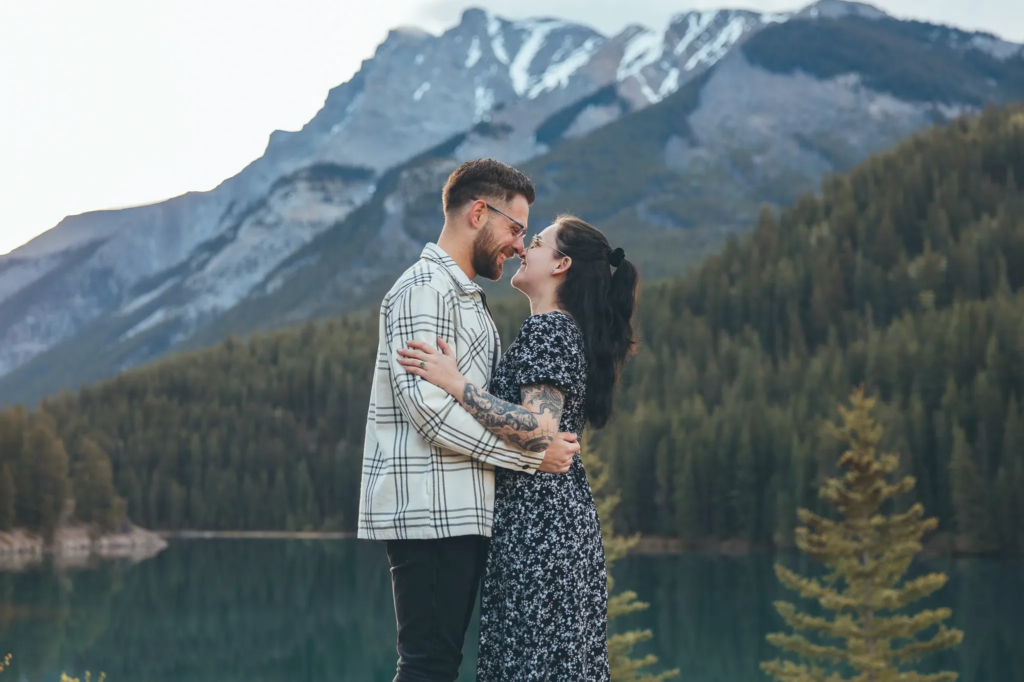 135_Couple-Embracing-Canadian-Rockies-Alpine-Lake.webp