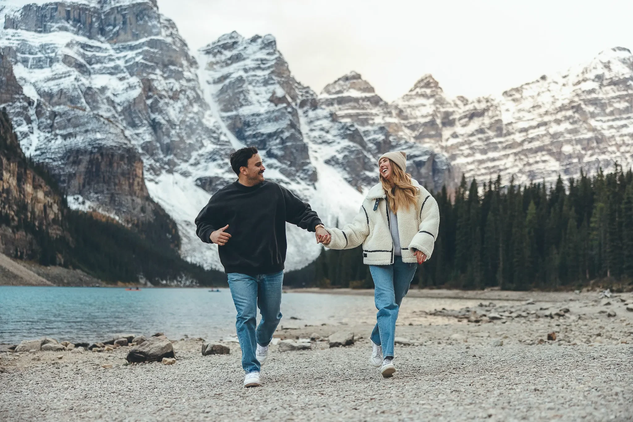 108_Couple-Walking-Alpine-Lake-Banff.webp