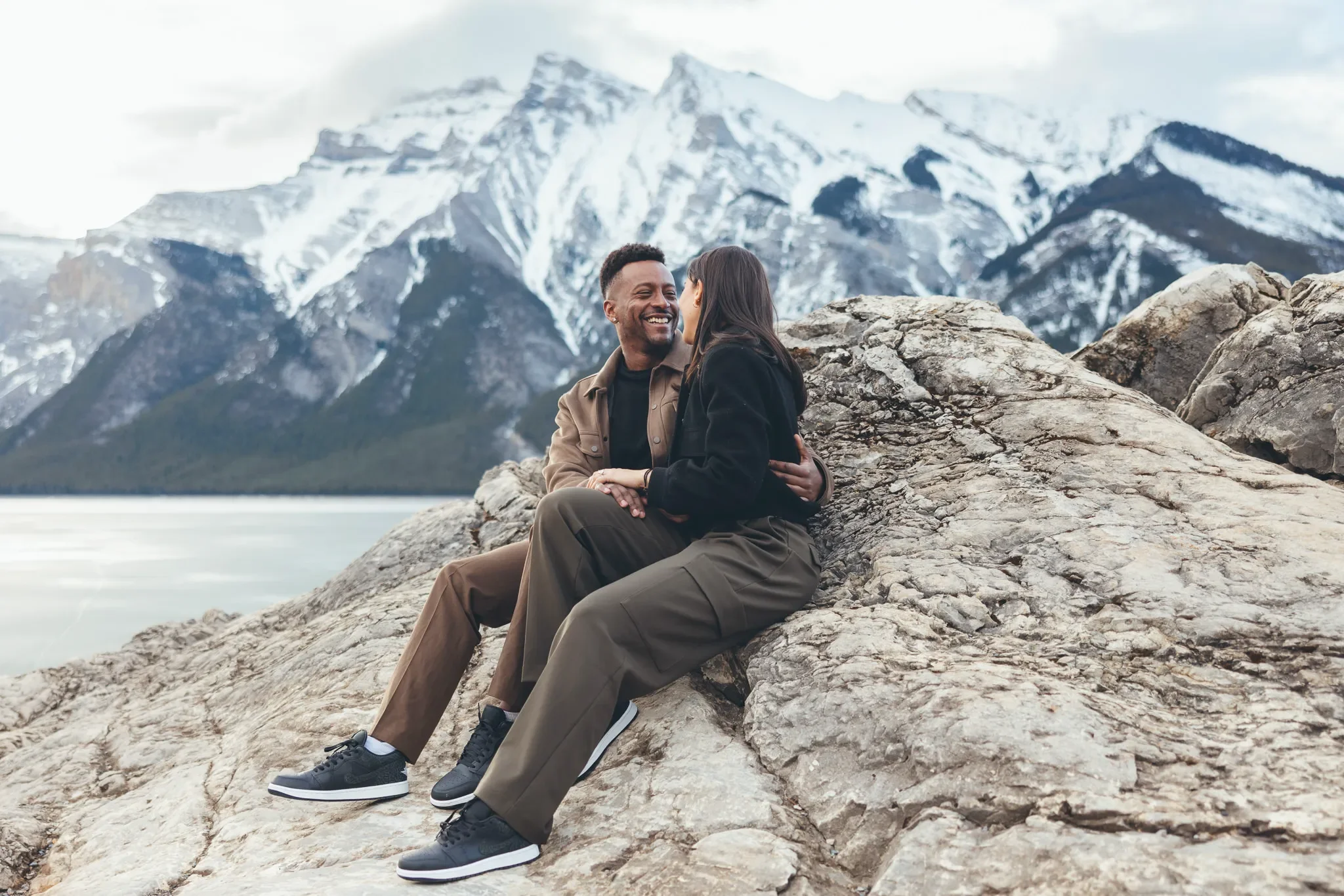 124_Couple-Sitting-On-Rocks-Canadian-Rockies-Mountain-Viewpoint.webp