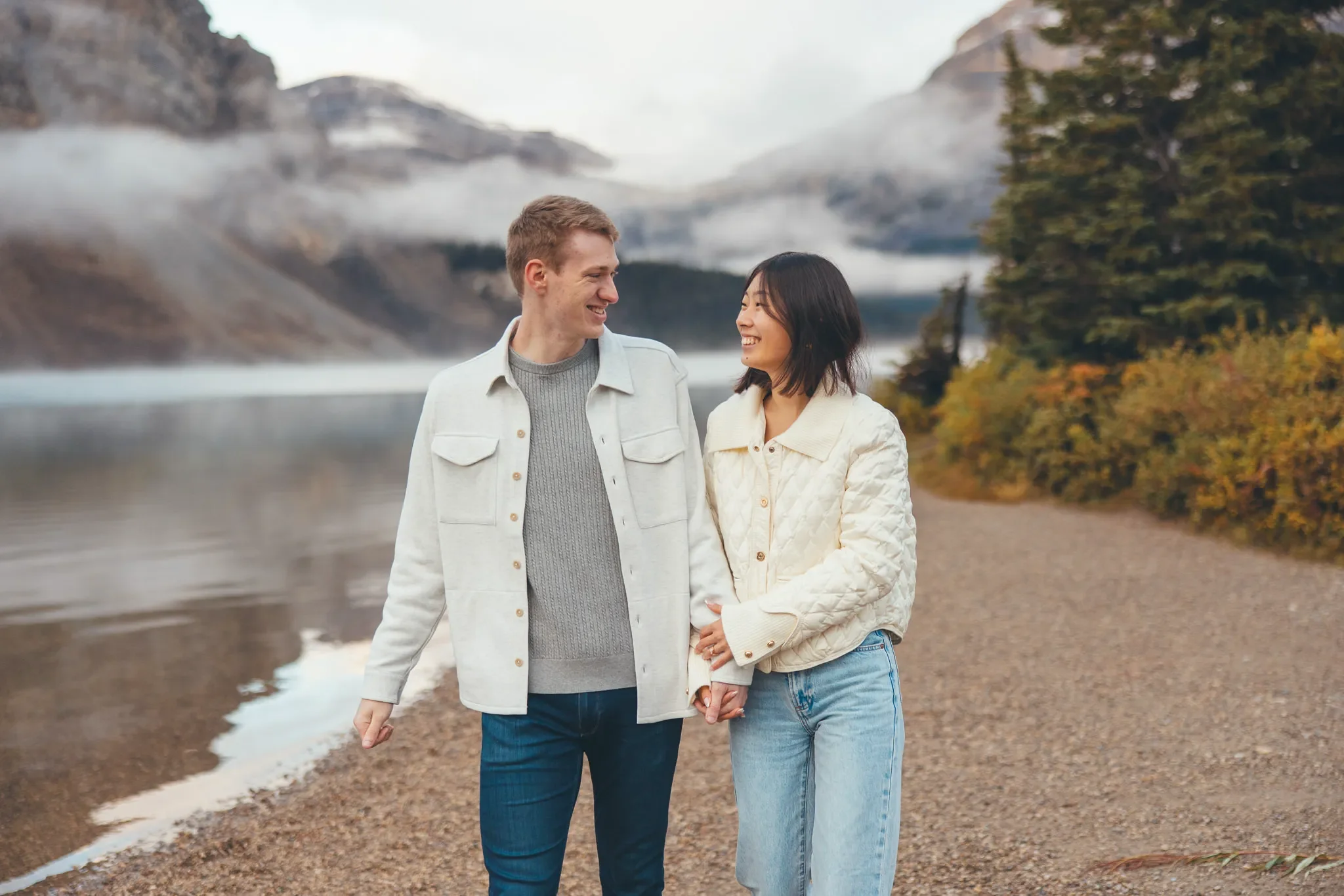 131_Couple-Walking-Hand-In-Hand-Alpine-Lake-Canadian-Rockies.webp
