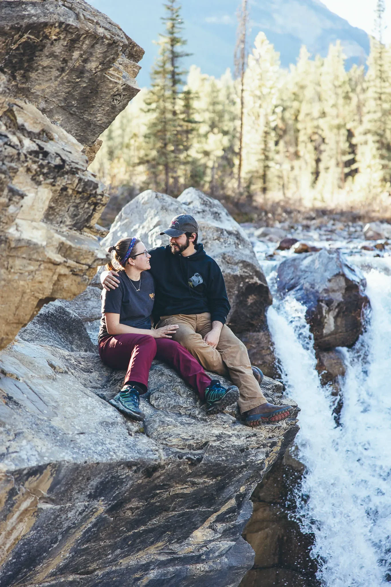 137_Couple-Sitting-By-Waterfall-Canadian-Rockies.webp