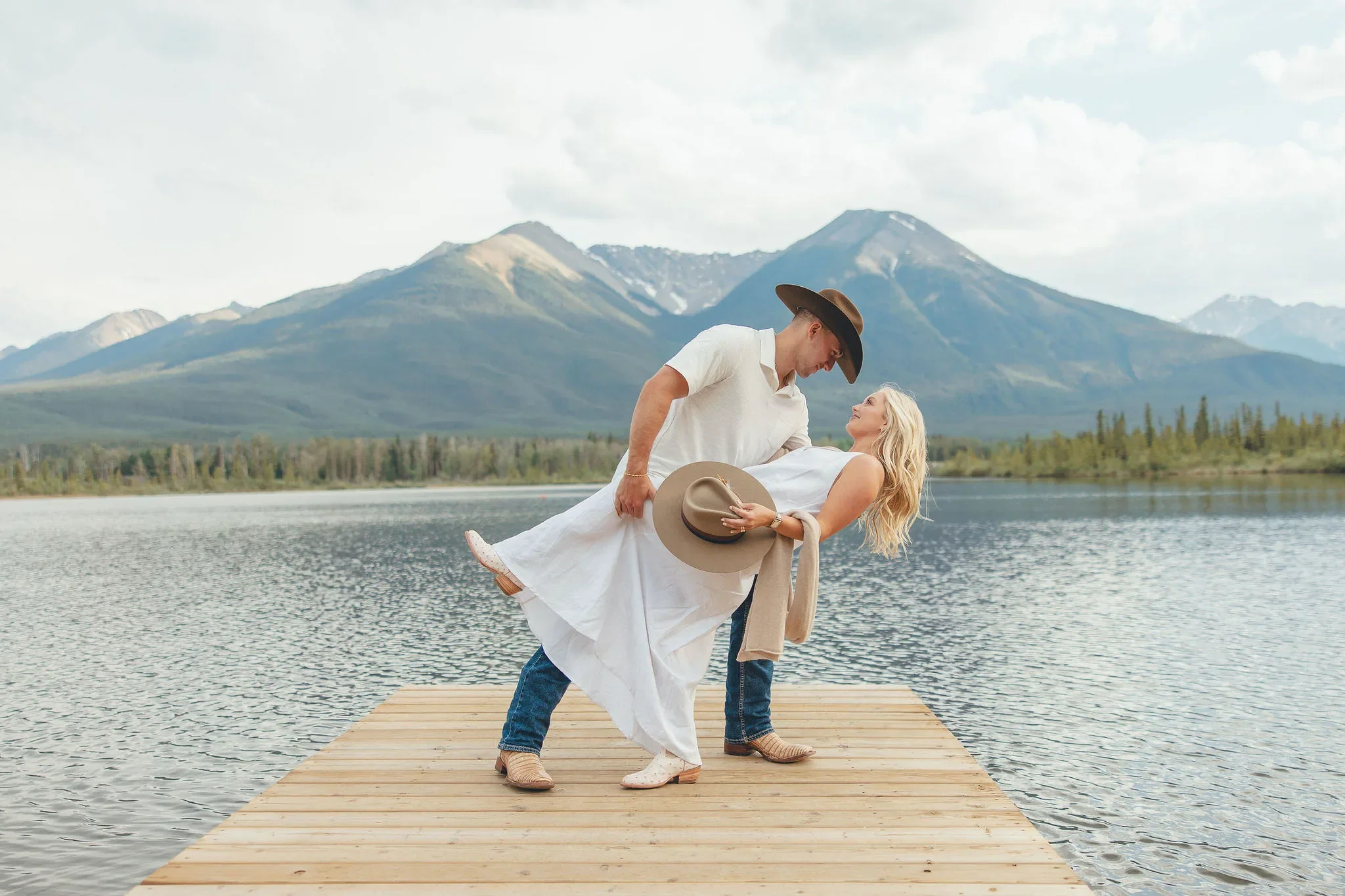 144_couple-romantic-dip-on-dock-canadian-rockies-mountain-lake.webp