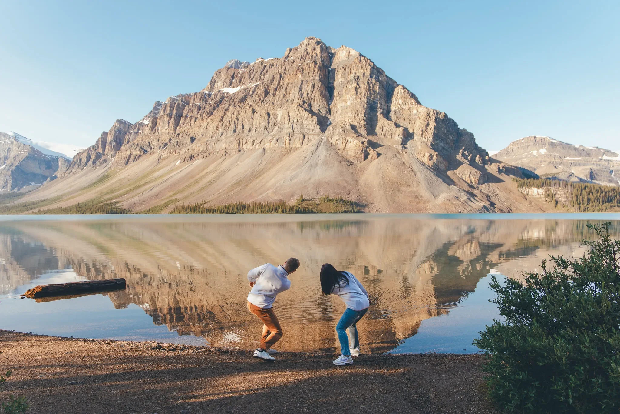 101_Couple-Skipping-Stones-Alpine-Lake-Canadian-Rockies.webp