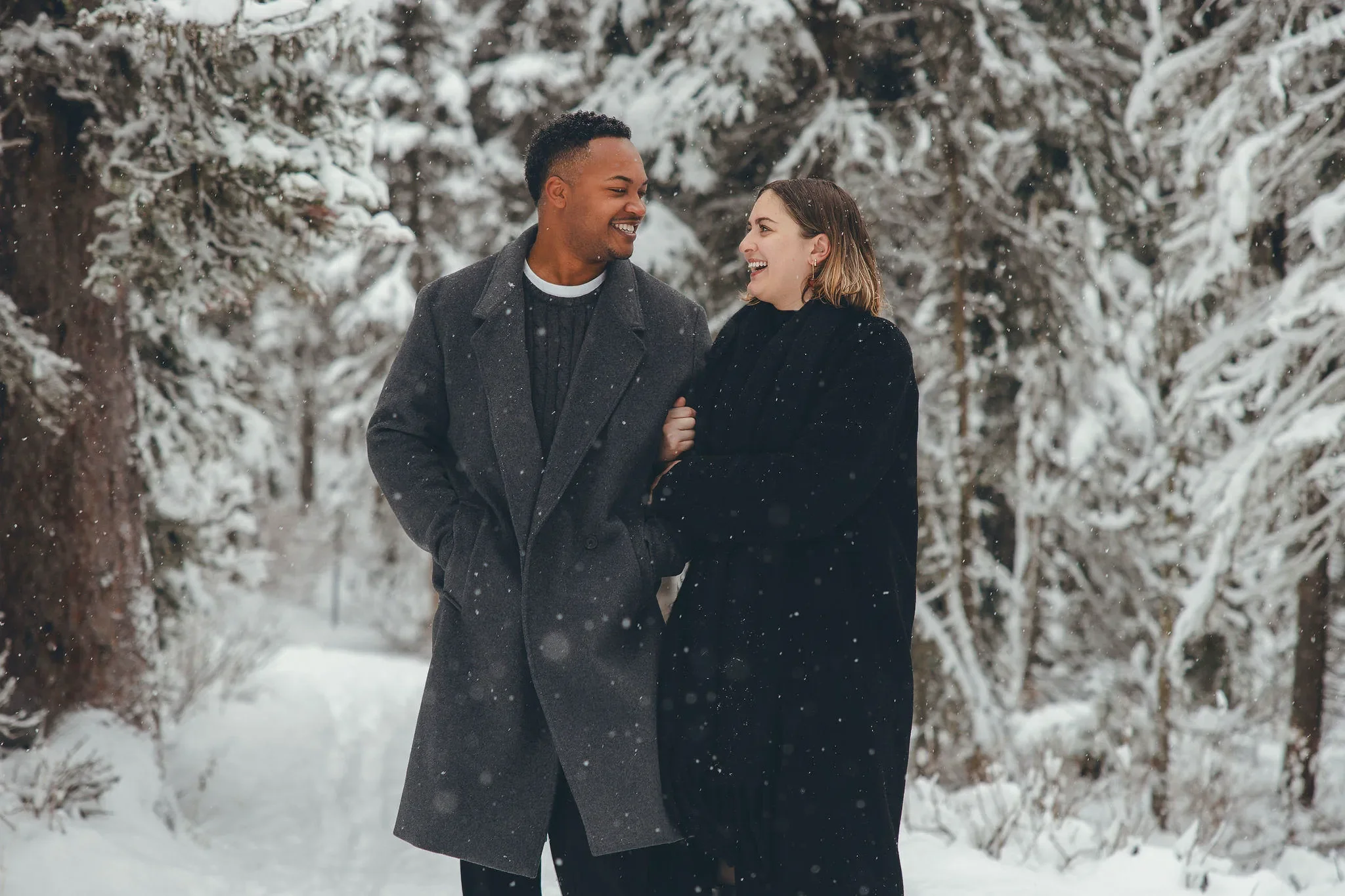 140_Couple-Walking-Snowy-Forest-Winter-Portrait.webp