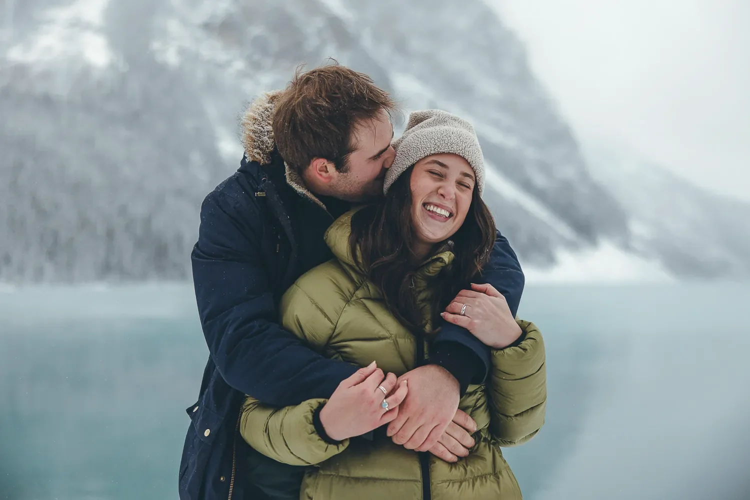 114_couple-engagement-lake-louise-banff-winter-mountains.webp