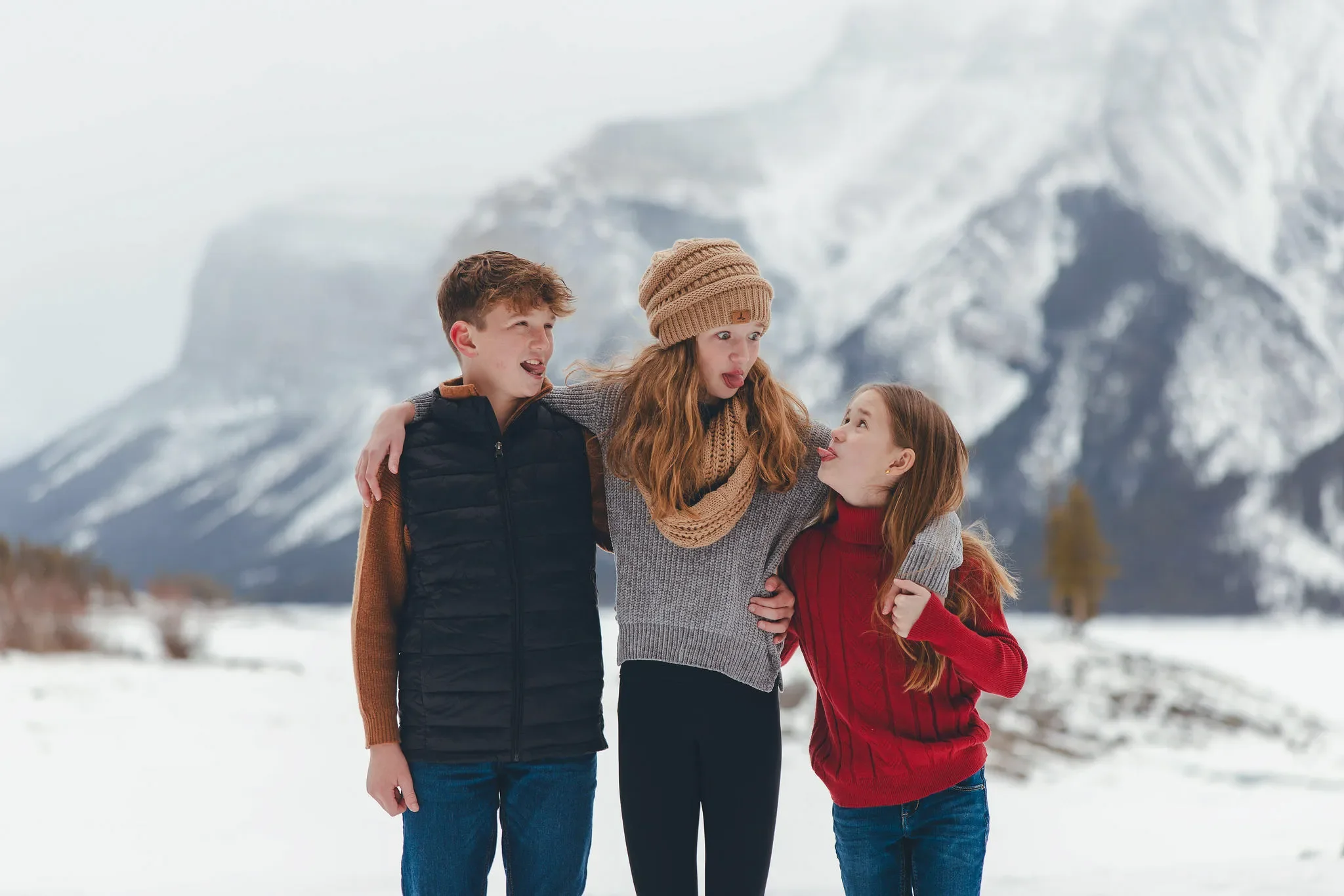 118_kids-making-silly-faces-canadian-rockies-winter.webp