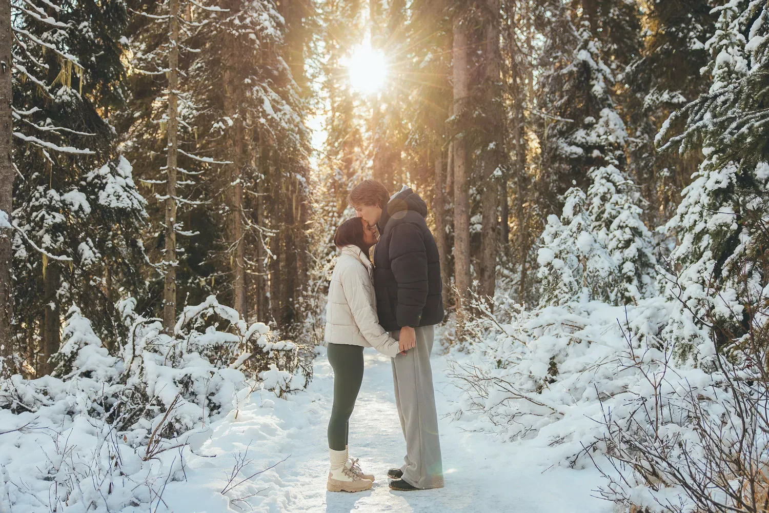 120_Couple-Forehead-Kiss-Snowy-Forest-Golden-Hour.webp