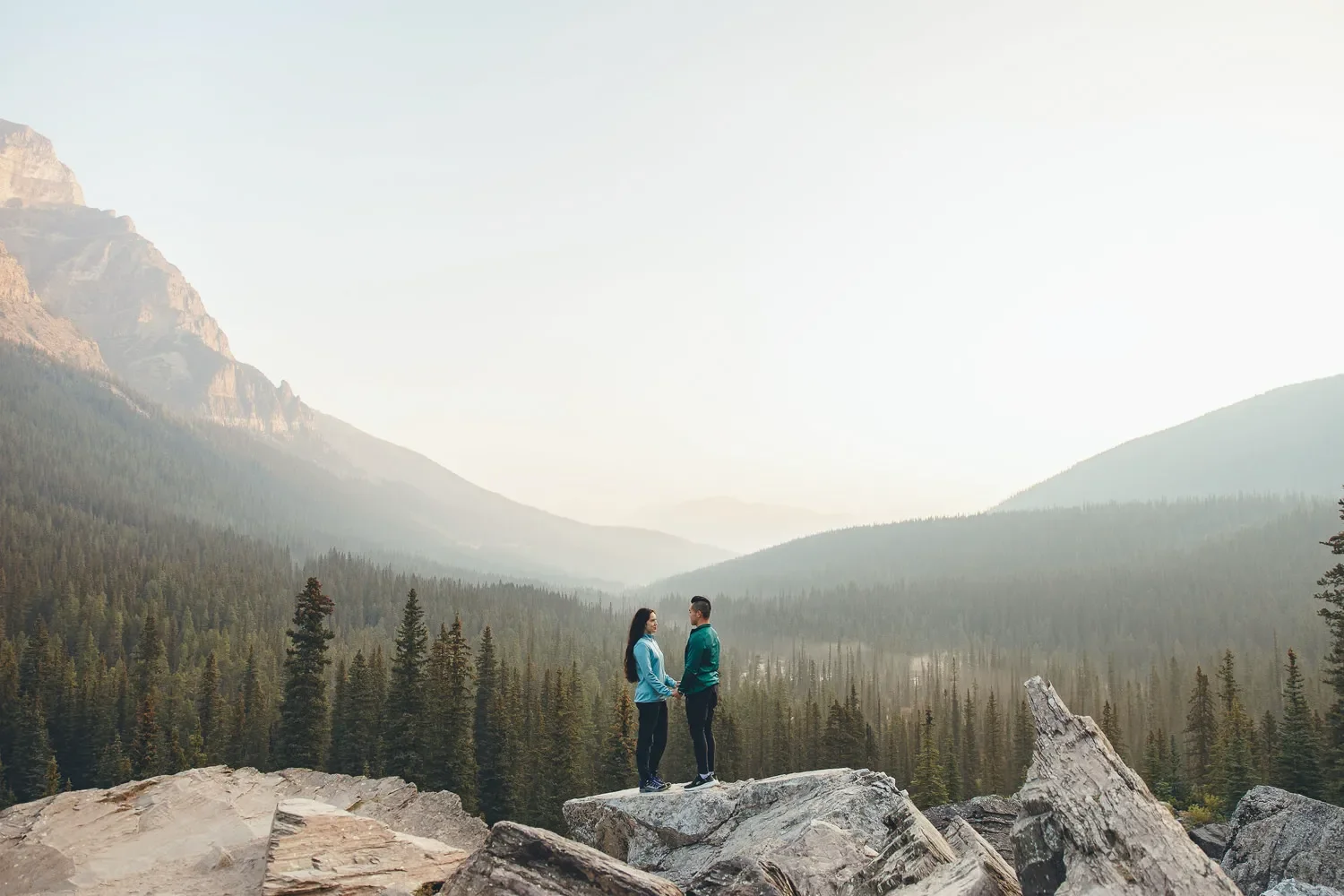 112_couple-holding-hands-moraine-lake-mountain-viewpoint.webp