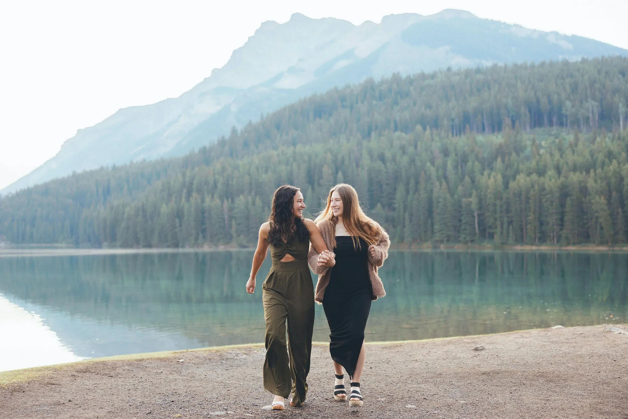 127_couple-walking-alpine-lake-canadian-rockies.webp