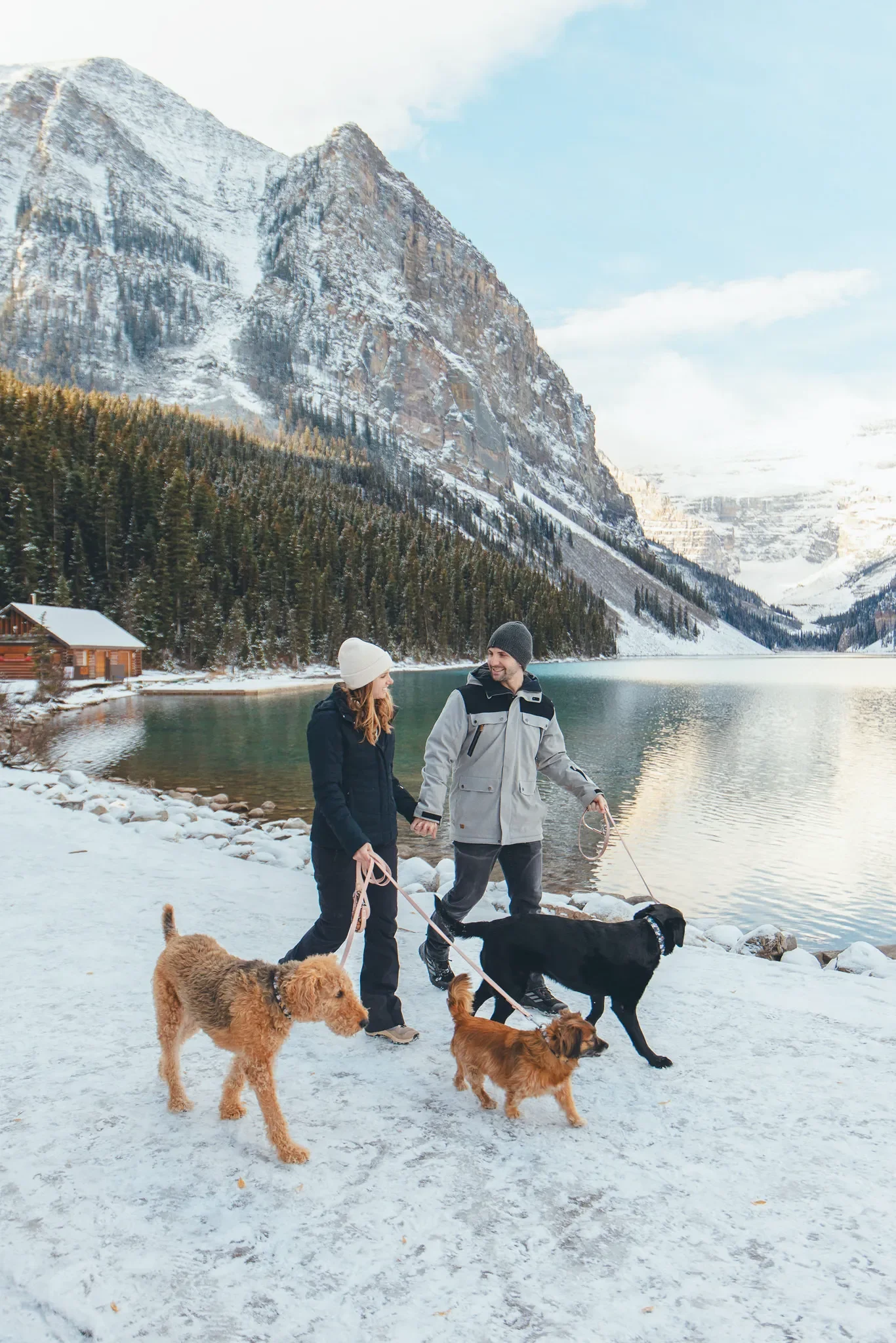 153_Couple-Walking-Dogs-Lake-Louise-Banff-Mountains.webp