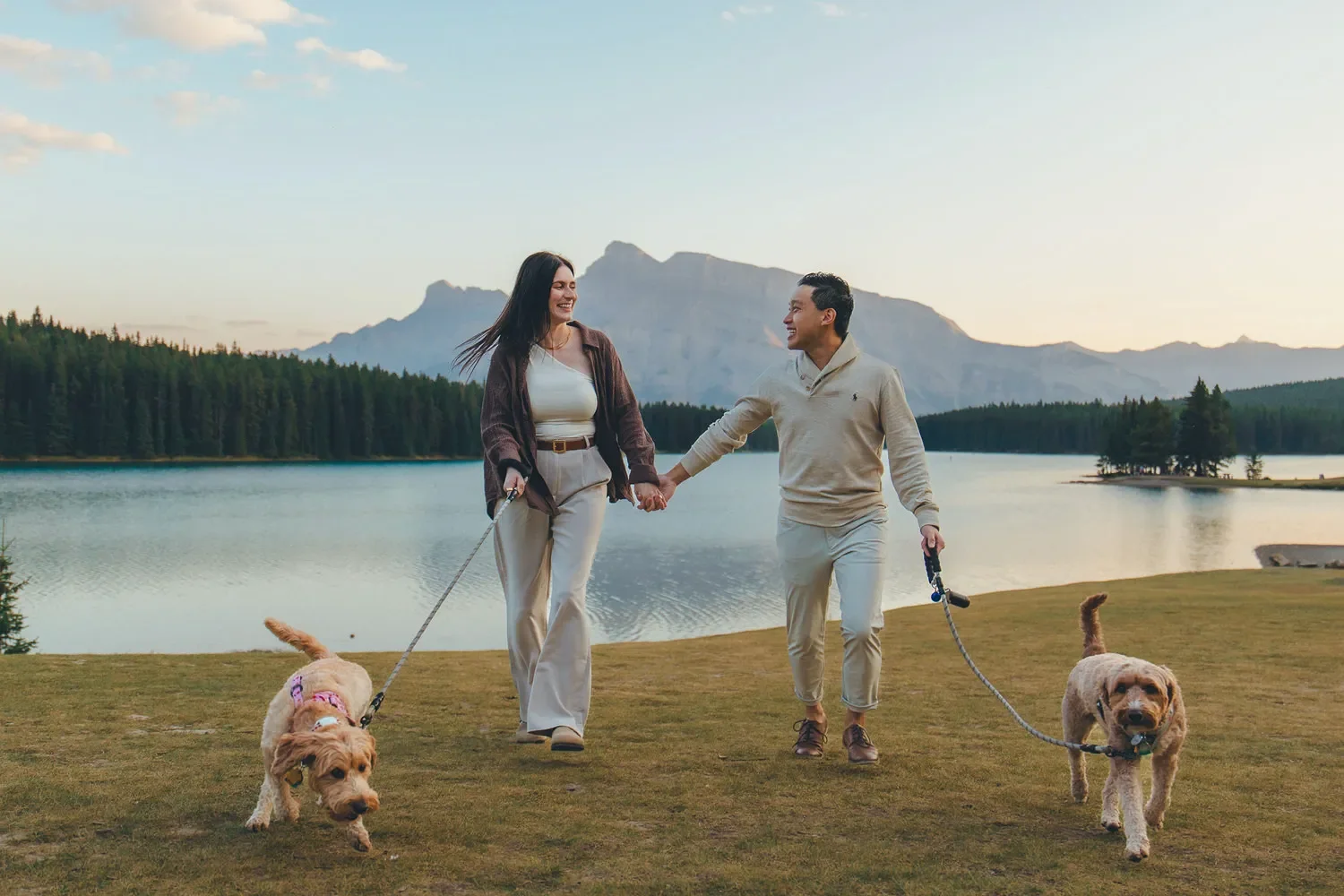105_Couple-Walking-Dogs-Banff-Mountain-Lake-Golden-Hour.webp