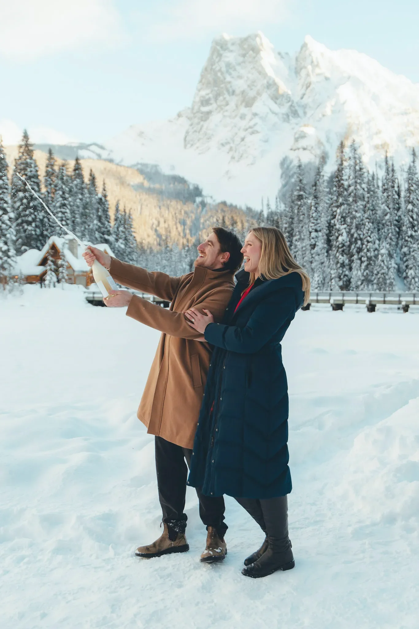 118_couple-popping-champagne-canadian-rockies.webp
