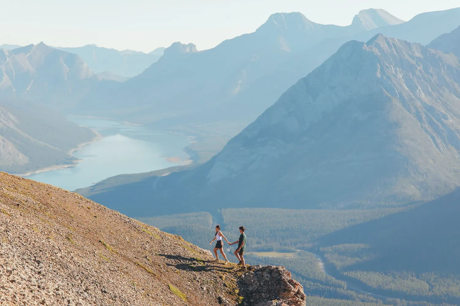 104_Couple-Hiking-Mountain-Trail-Alpine-Lake-Canadian-Rockies.webp