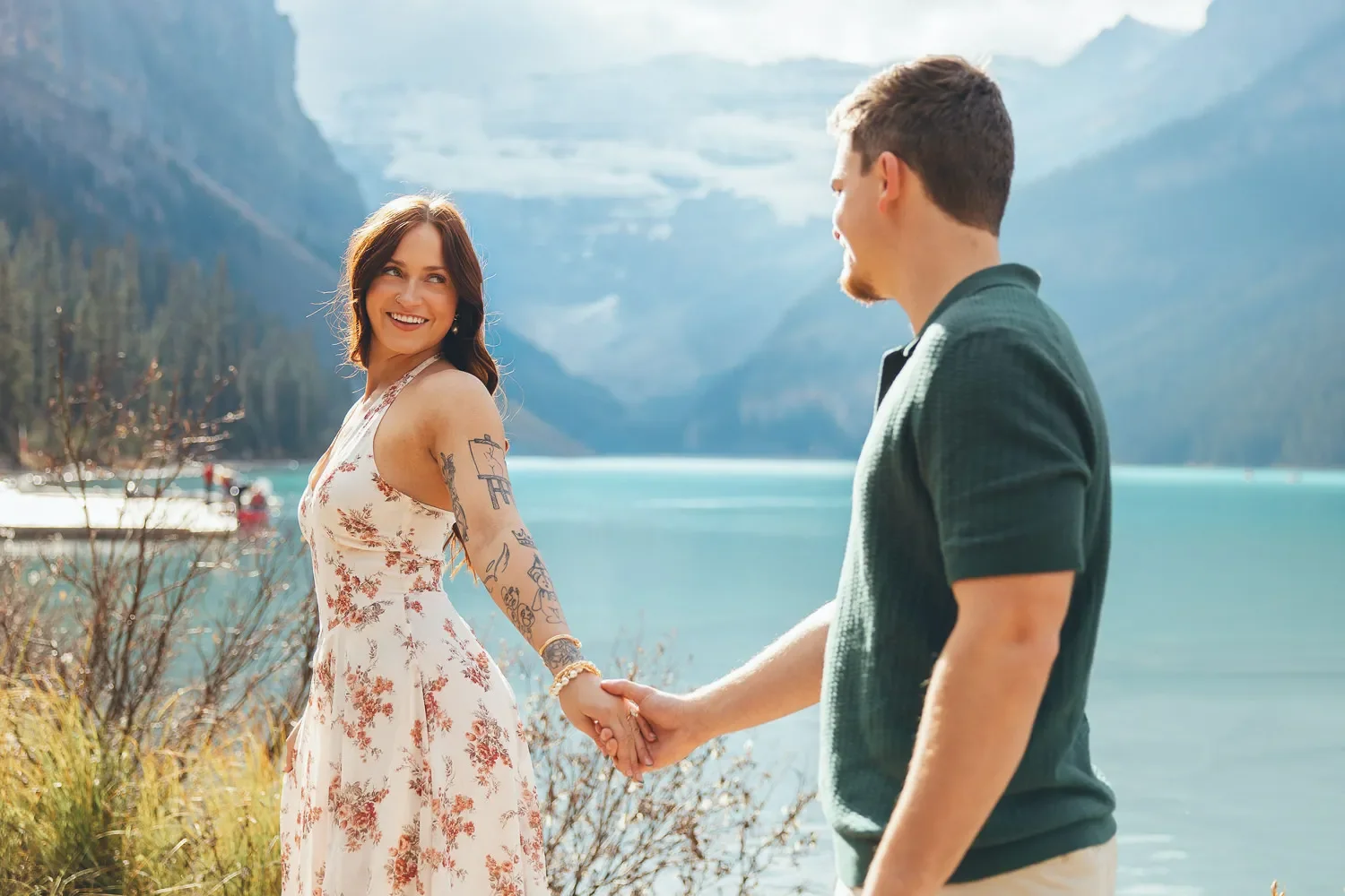 113_Couple-Walking-Lake-Louise-Banff-Mountains.webp