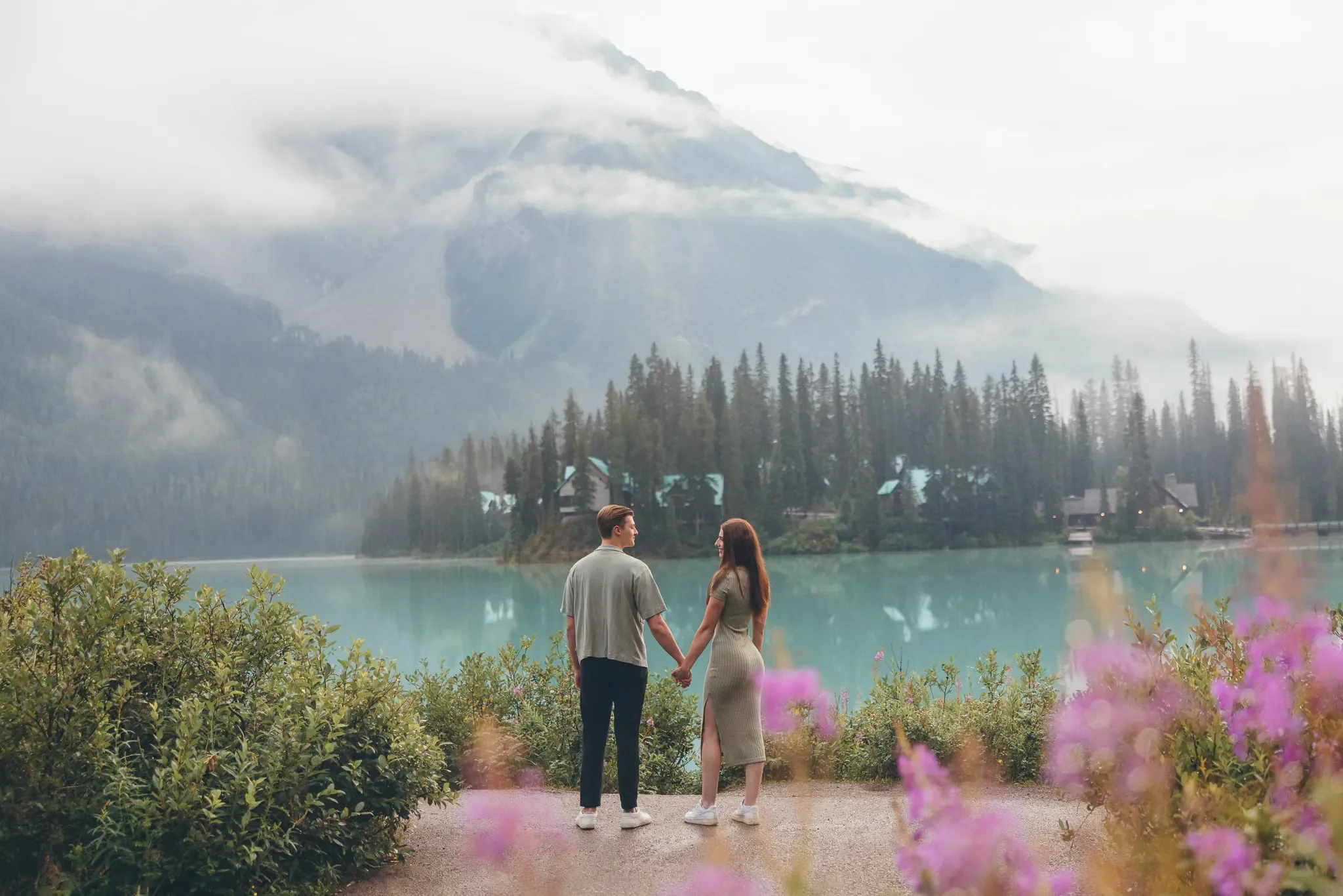118_couple-holding-hands-mountain-landscape-alpine-lake.webp