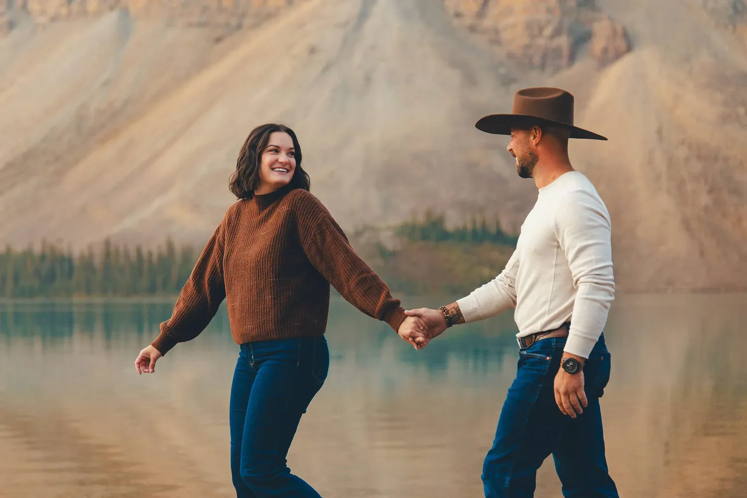 112_Couple-Walking-Holding-Hands-Alpine-Lake-Canadian-Rockies.webp