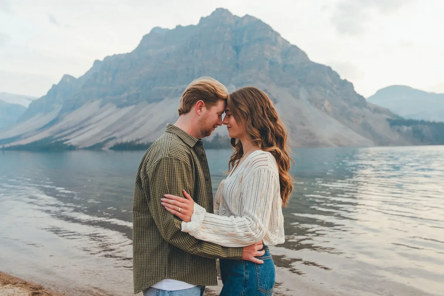 115_couple-engagement-portrait-canadian-rockies-mountain-lake.webp