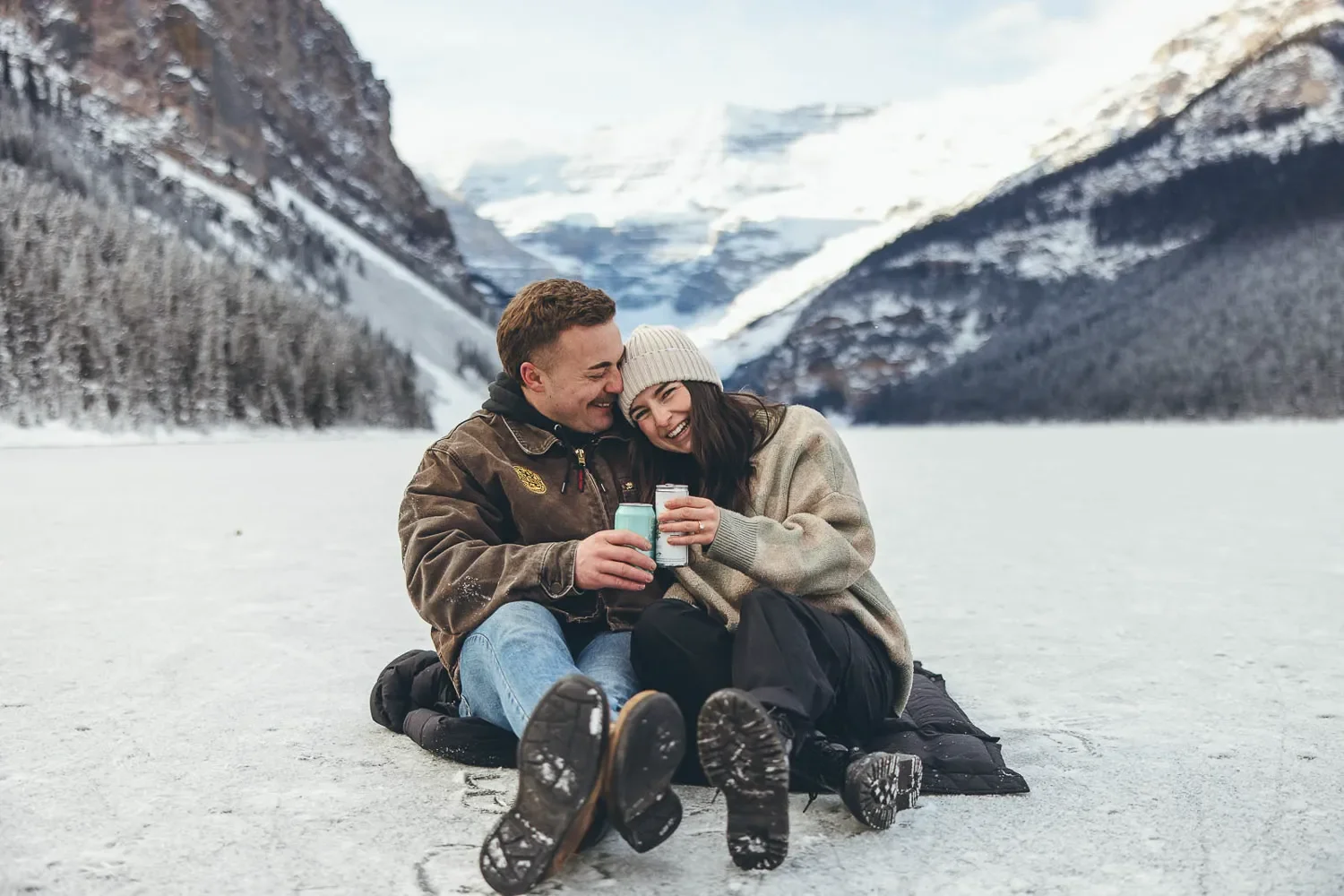 122_Couple-Laughing-Lake-Louise-Banff-Winter-Mountains.webp