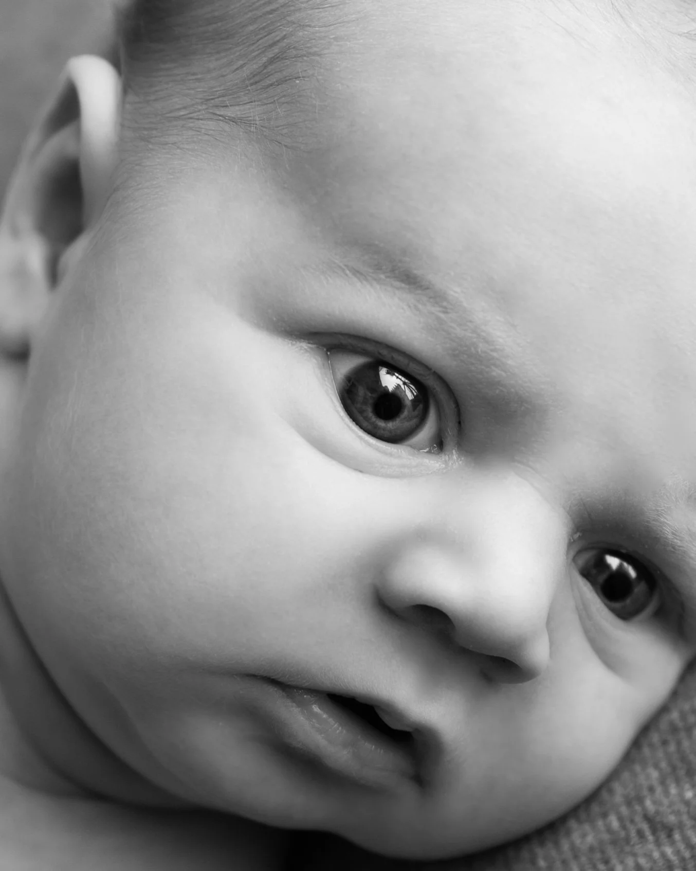 Black and White close up of a newborn baby's face at his photoshoot in the Ballynahinch Studio