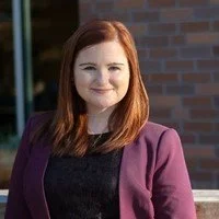 Kayla Hansen in front of brick building