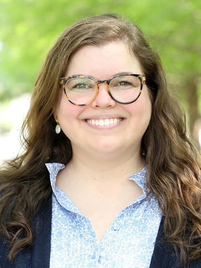 Dr. Kathryn Janda-Thomte outside with trees