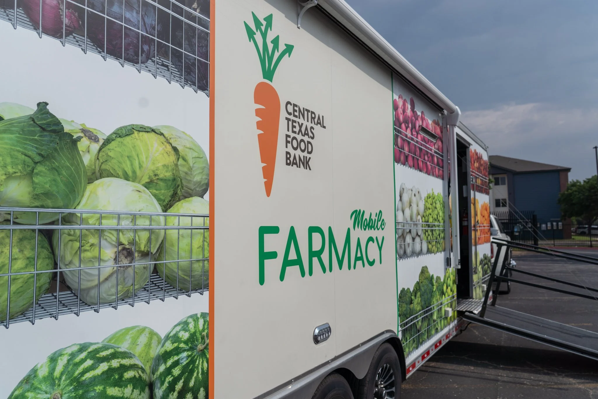 Food Access and Charitable Services: Close-up of side of Central Texas Food Bank Mobile FARMacy trailer