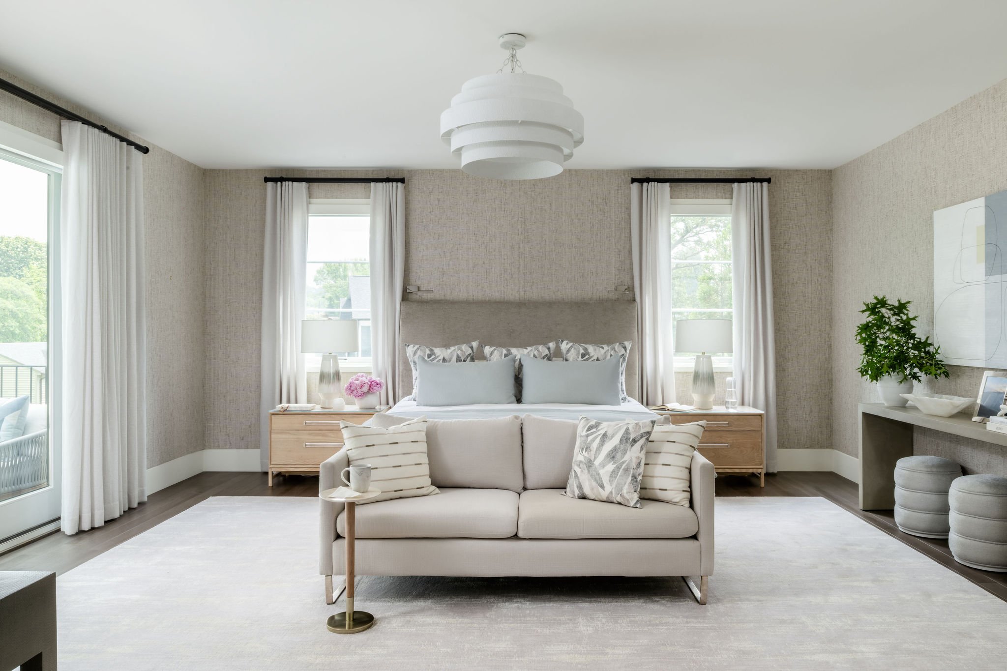 Still in love with this serene Main Bedroom suite! Layered lighting adds a special touch - chandelier for overall room light, lamps that create ambiance, dedicated his-and-hers reading lights, custom nightstands with built-in electrified drawers, and
