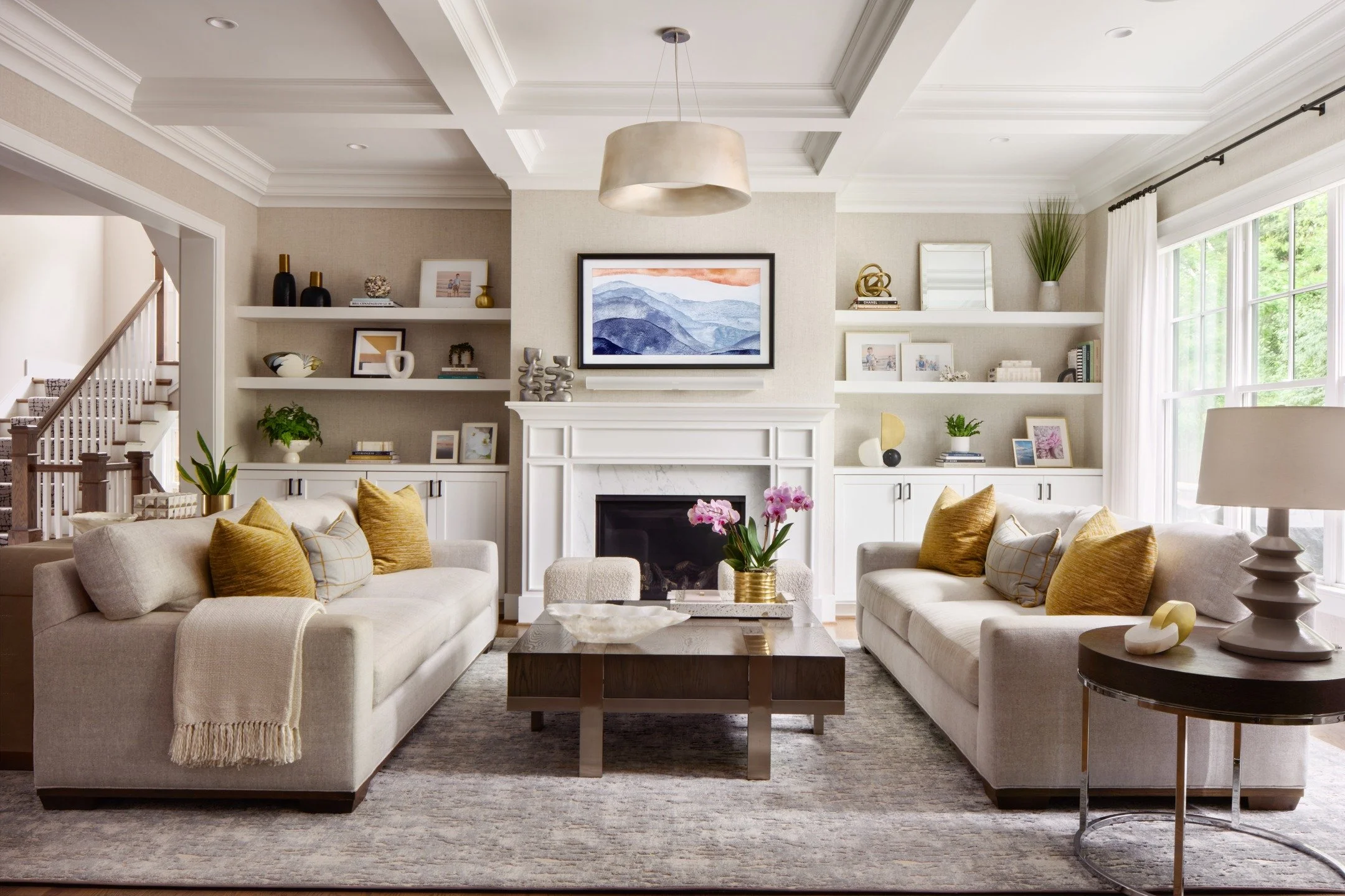 Furniture arrangement and a framed tv ensure this Family Room centers on conversation and time spent together, while still a cozy spot for the occasional movie night. 

📸 : @radiferaphotography 

#artdesignpartners #homedesign #moderndesign #livingr
