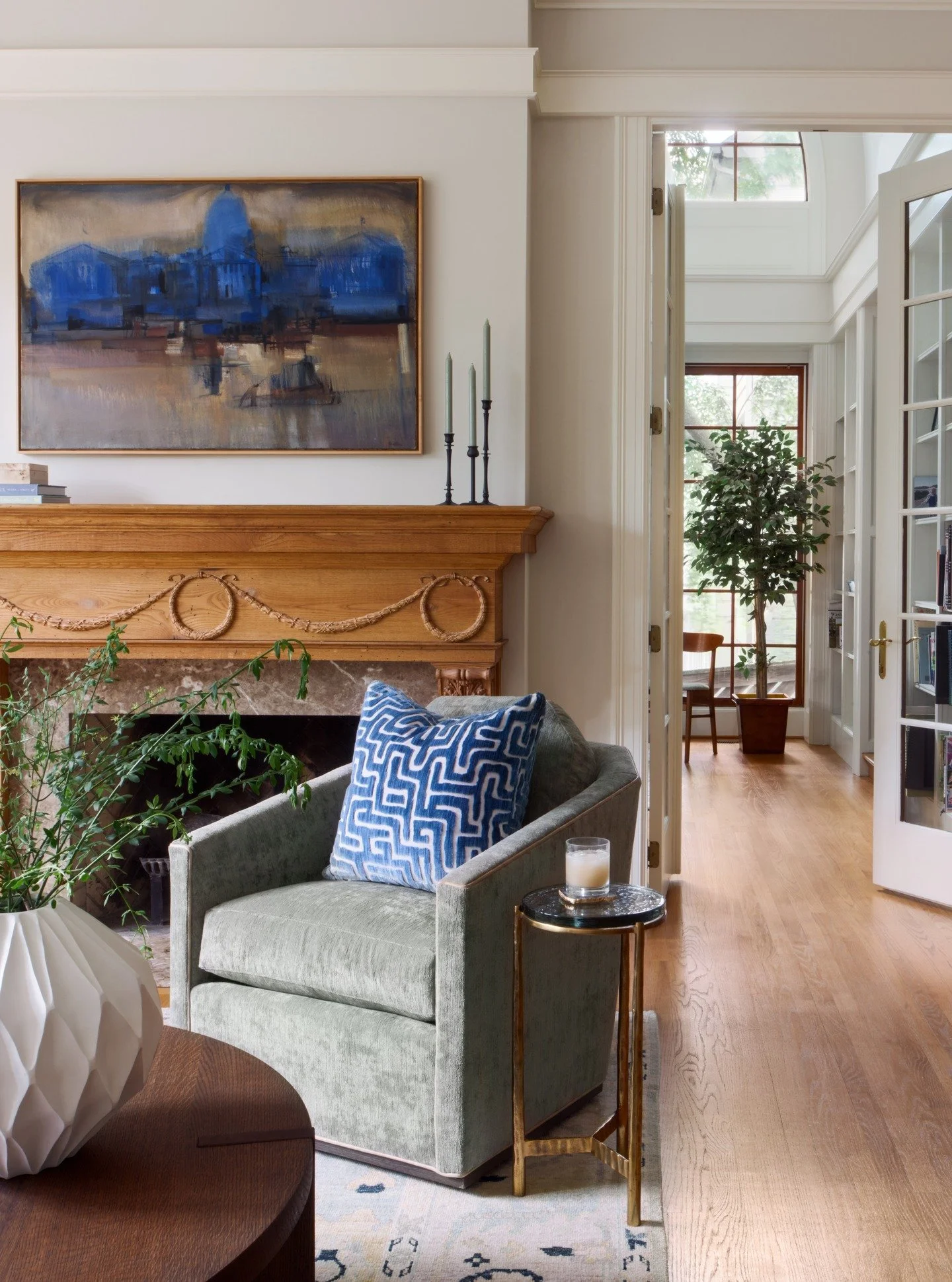 Charming architectural details in our clients' 1920s home are brought to life with a soft color palette of blues and greens in comfy, family-friendly furnishings. 
๐ธ : @radiferaphotography 
#artdesignpartners #homedesign #moderndesign #familyroomd