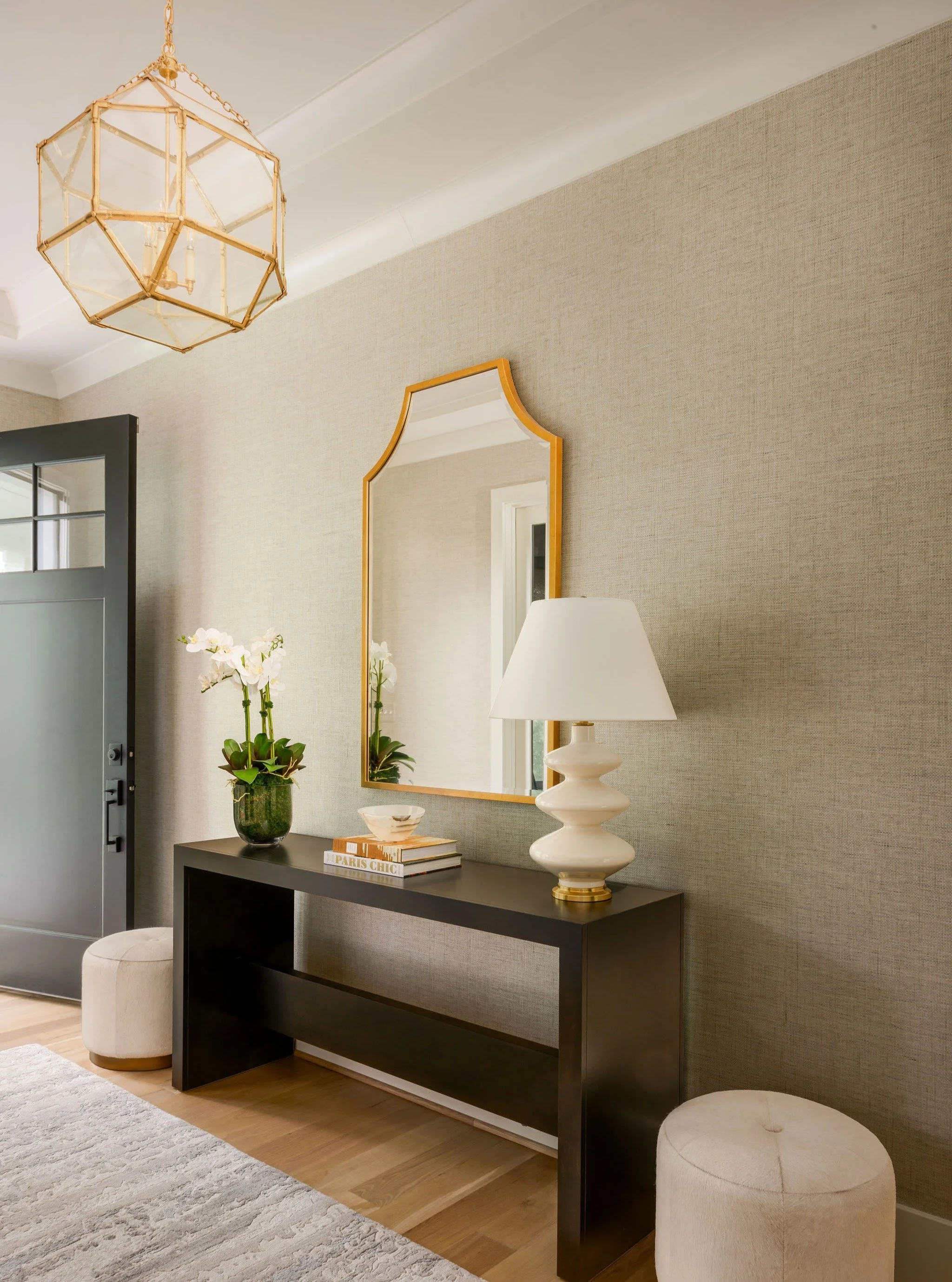 This Foyer is all about the details: textural wallpaper, sculptural lighting, durable rug, and a custom console just the right size and scale.

#artdesignpartners #foyer #foyerdesign #contemporarydesign #moderndesign #modernflair #moodboard #boldinte