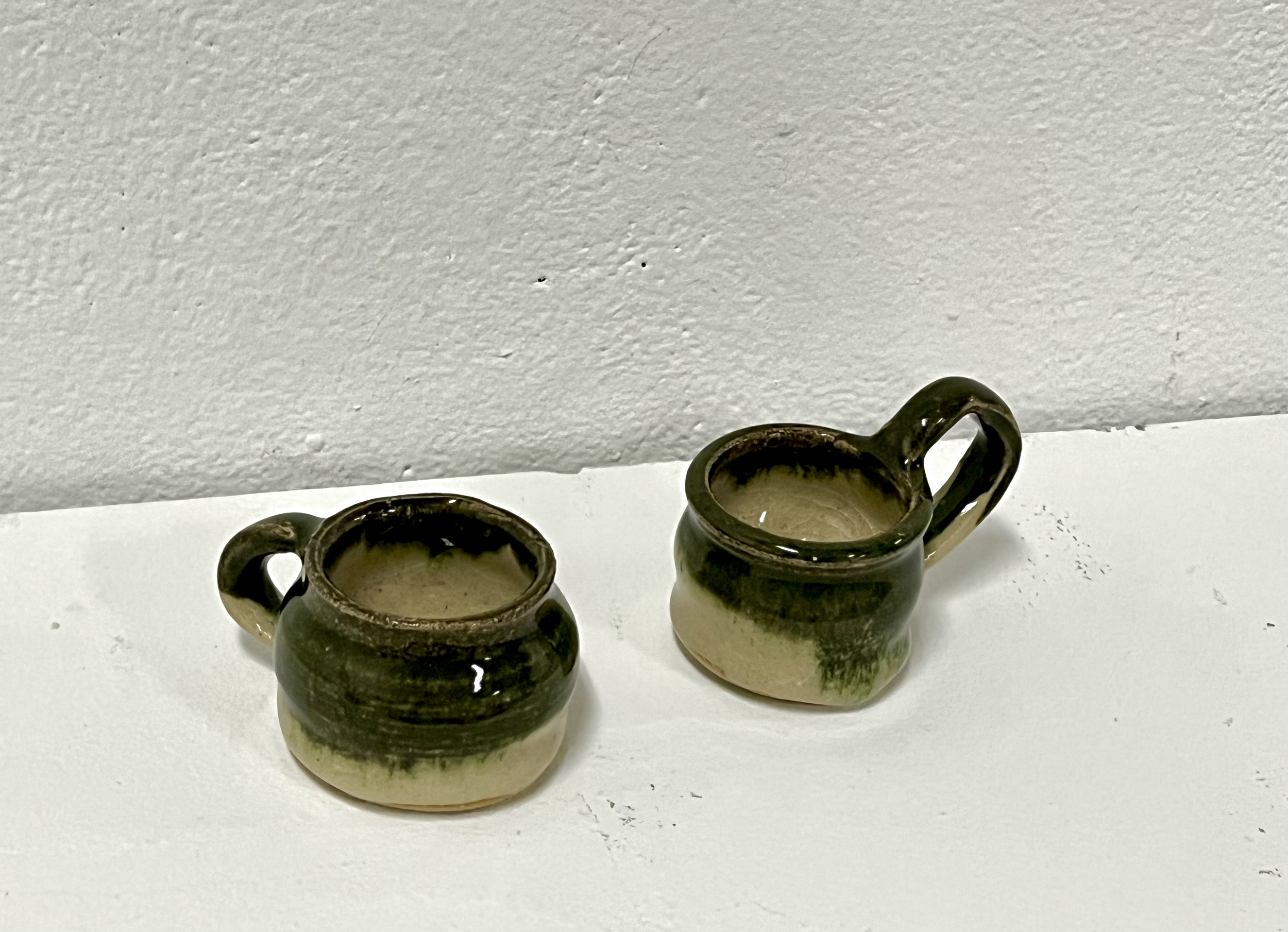 green drip teacups. wheel thrown stoneware, 2023.