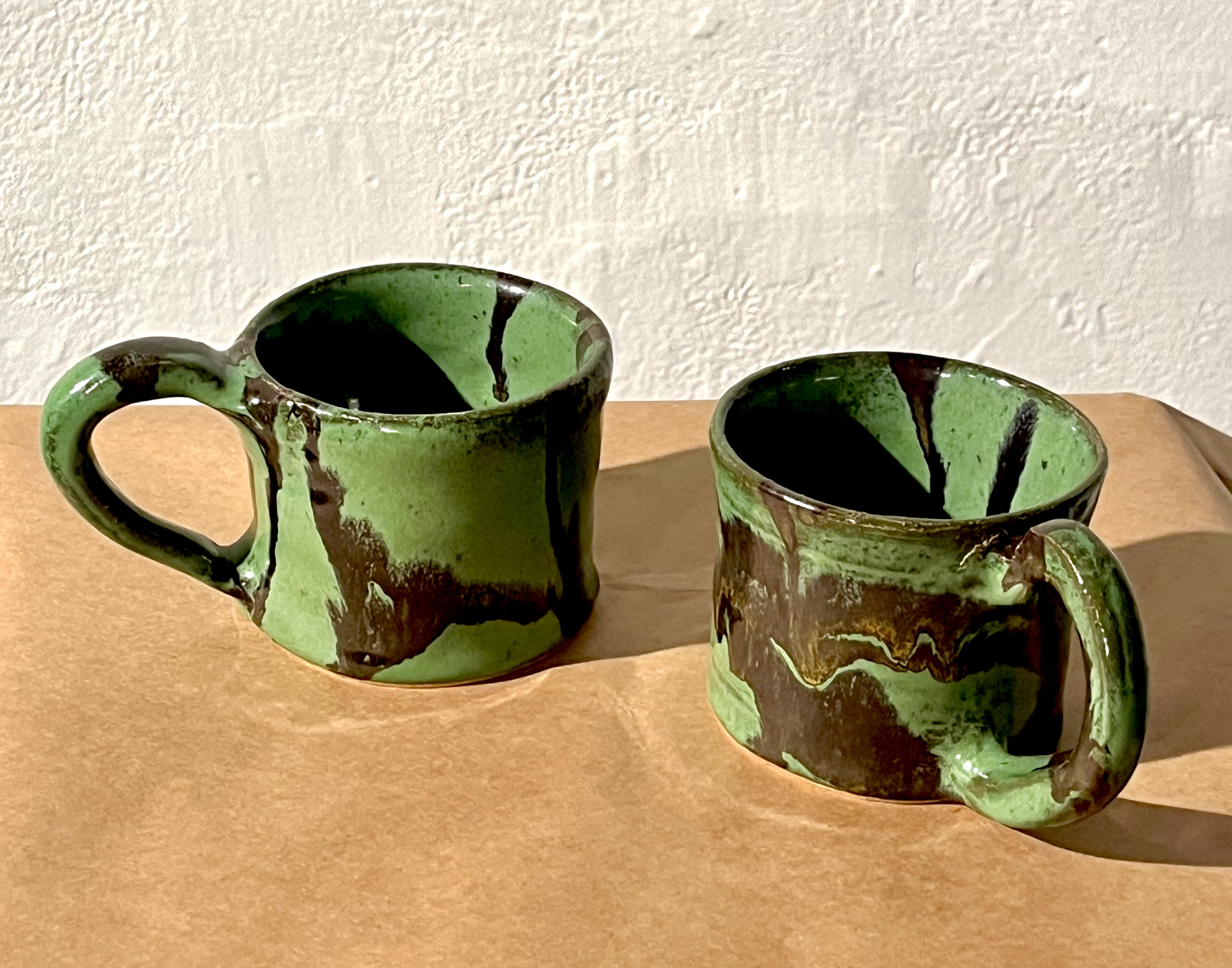green mugs, 2023.