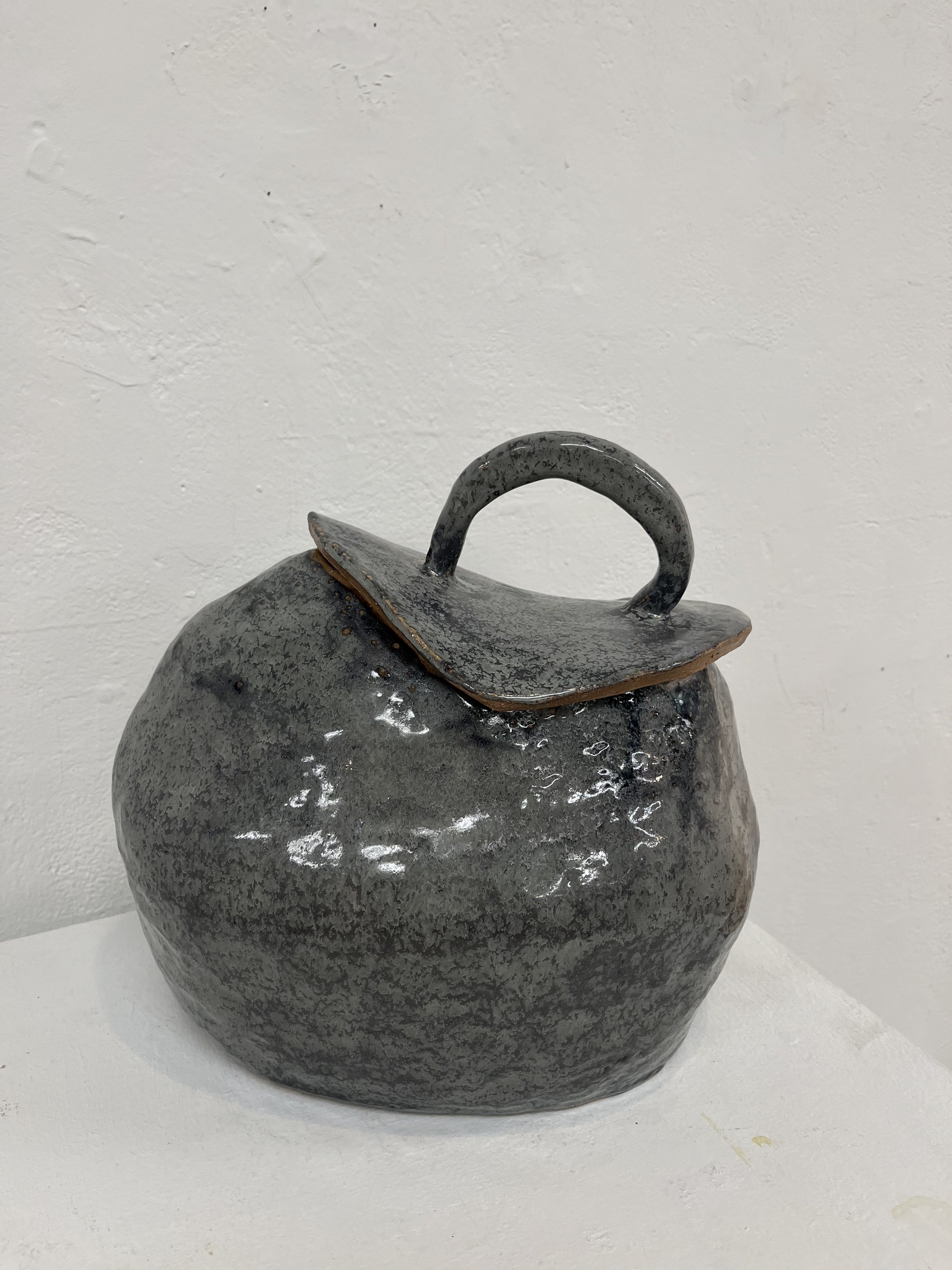 Stoneware jar with monster glaze