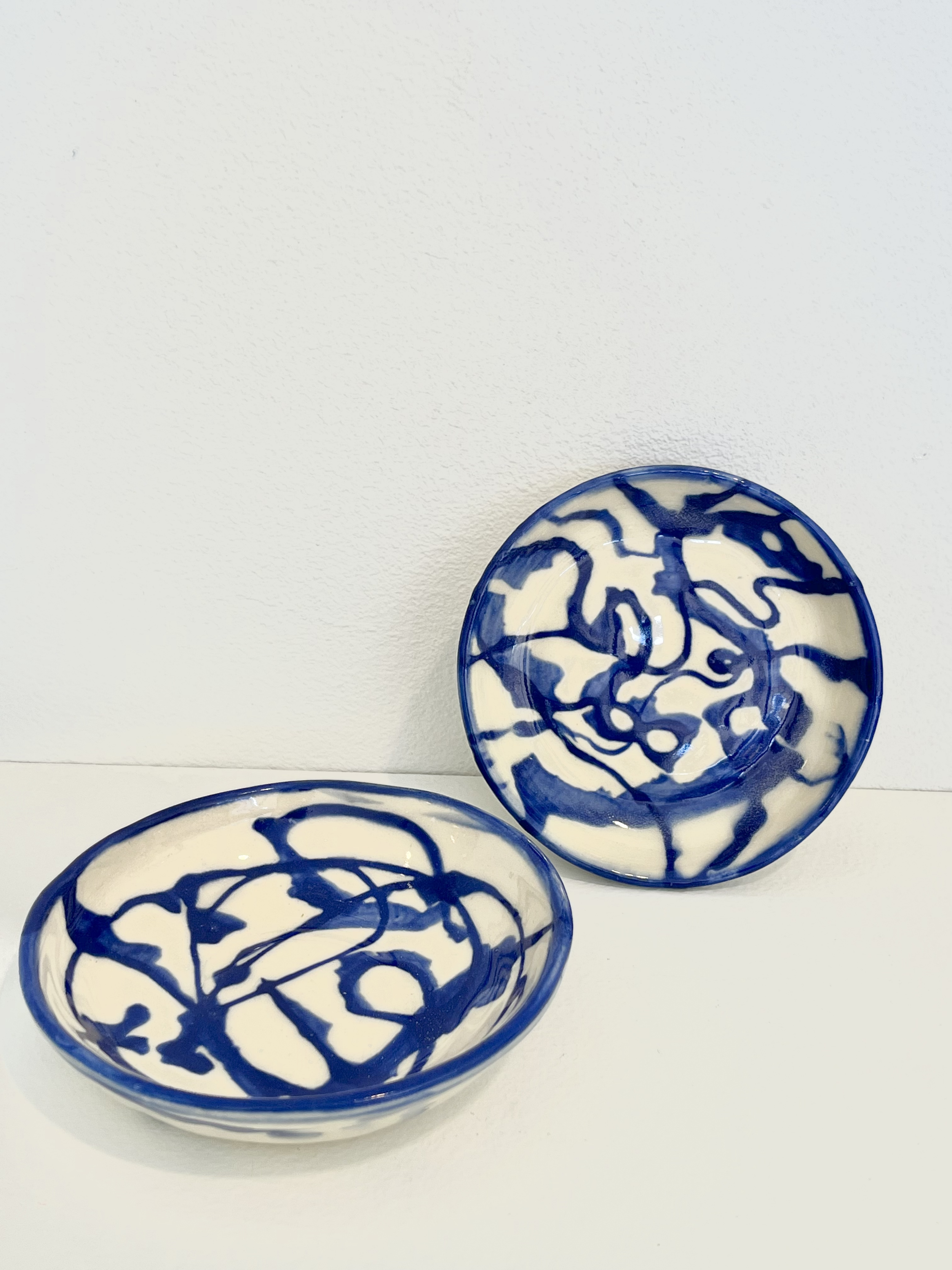 dribble dishes. thrown porcelain, 2023.