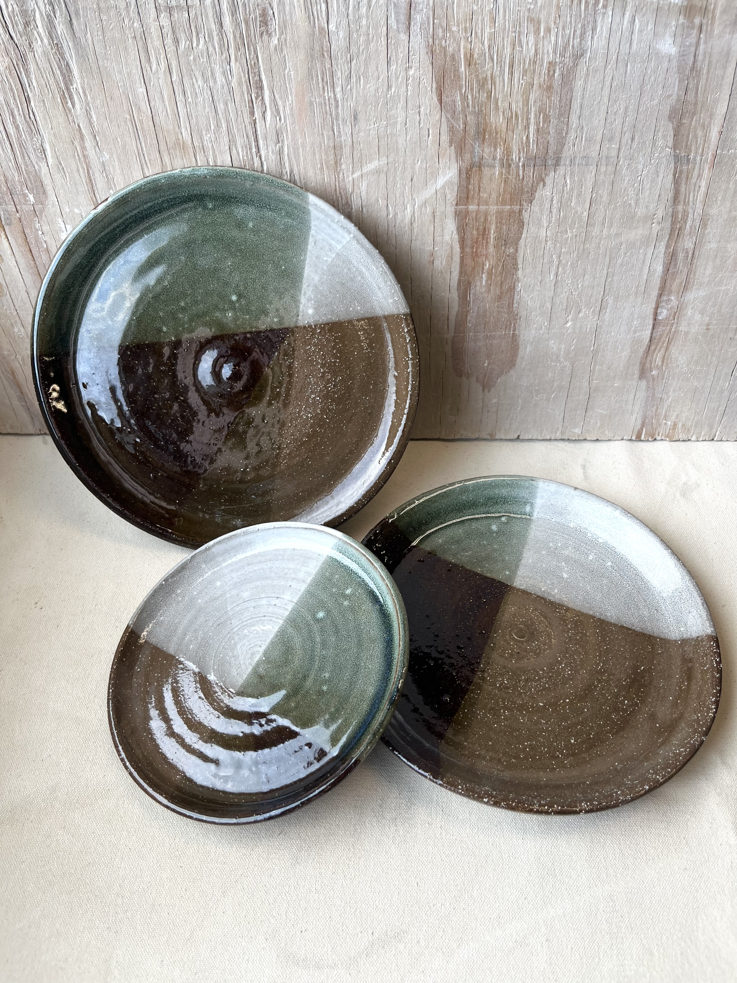Forest plates. Wheel thrown, red clay. 2023.