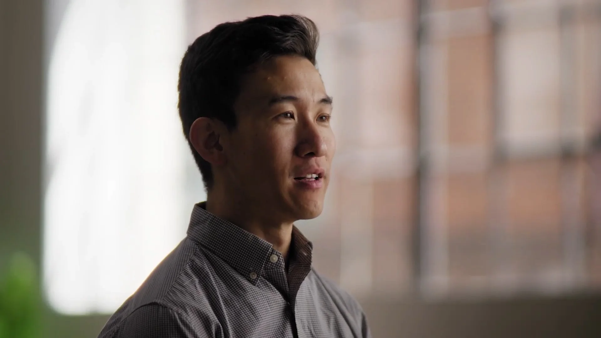 Still frame from a testimonial video for an AI startup based in San Francisco