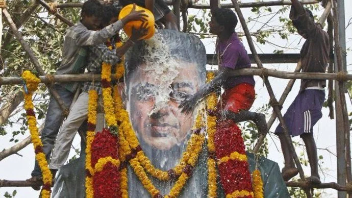 Fans of Film Star, Kamal Haasan pour milk on his life-sized cardboard cut-out in Chennai, Tamil Nadu, 2018. Photo Courtesy, India Today.
