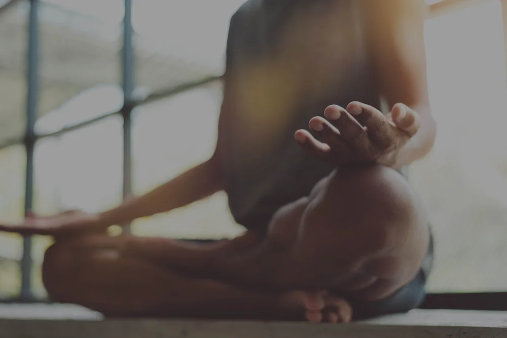 A quiet meditation practice in warm natural light