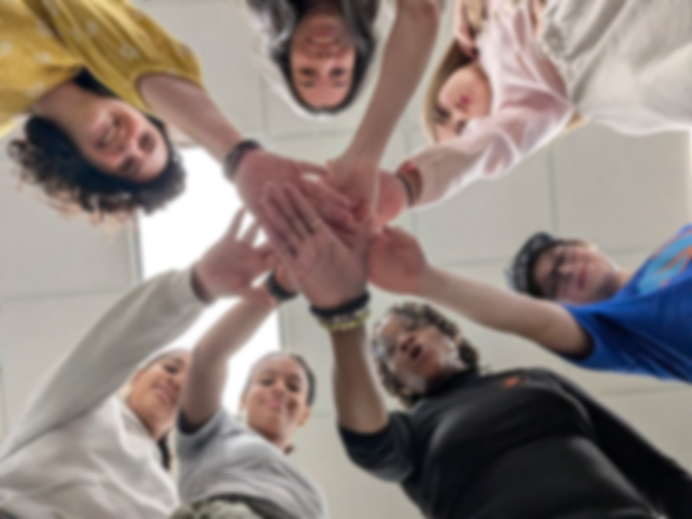 A group connecting through a collaborative wellness activity