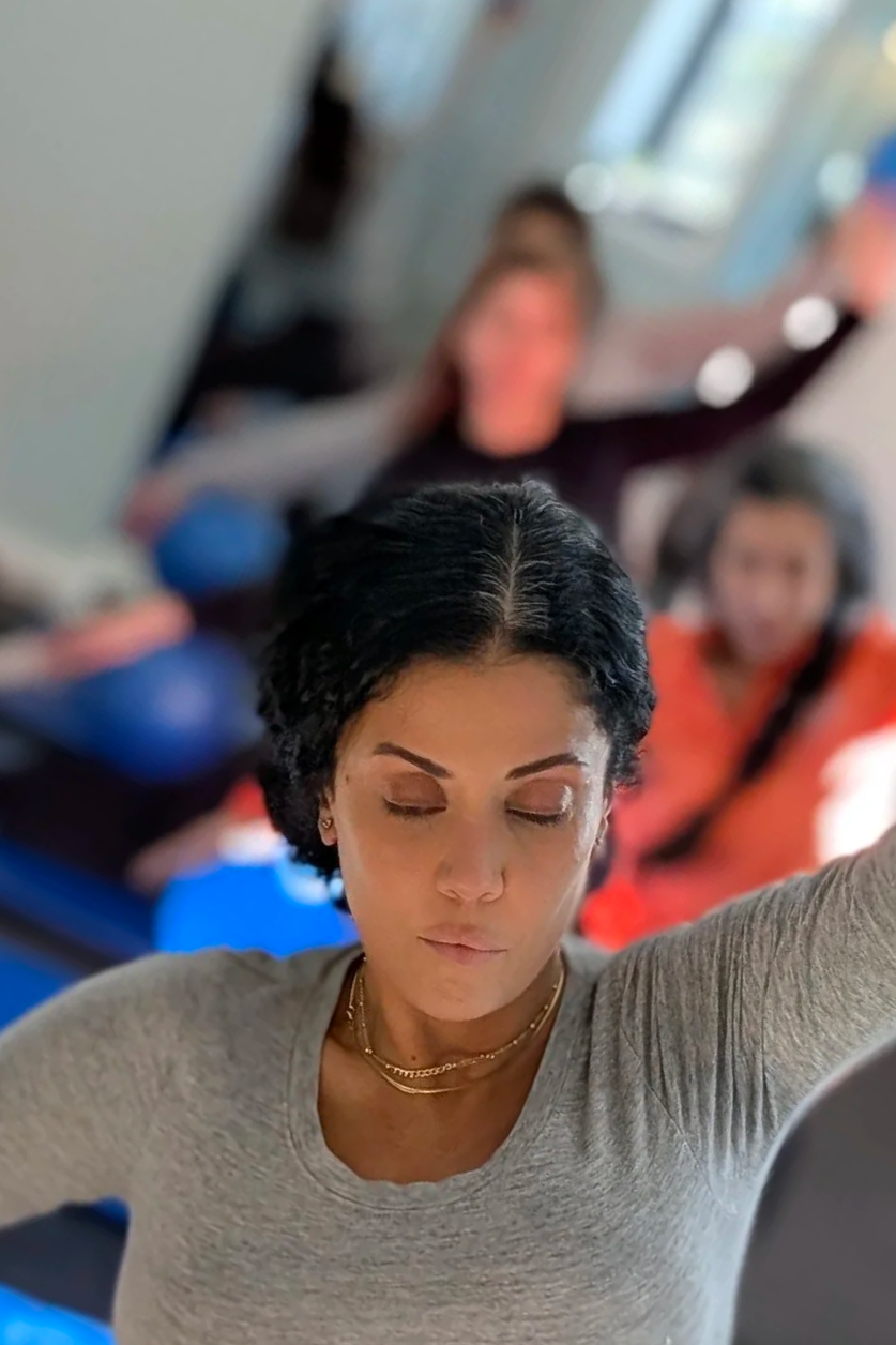 A focused Pilates practice by the canal