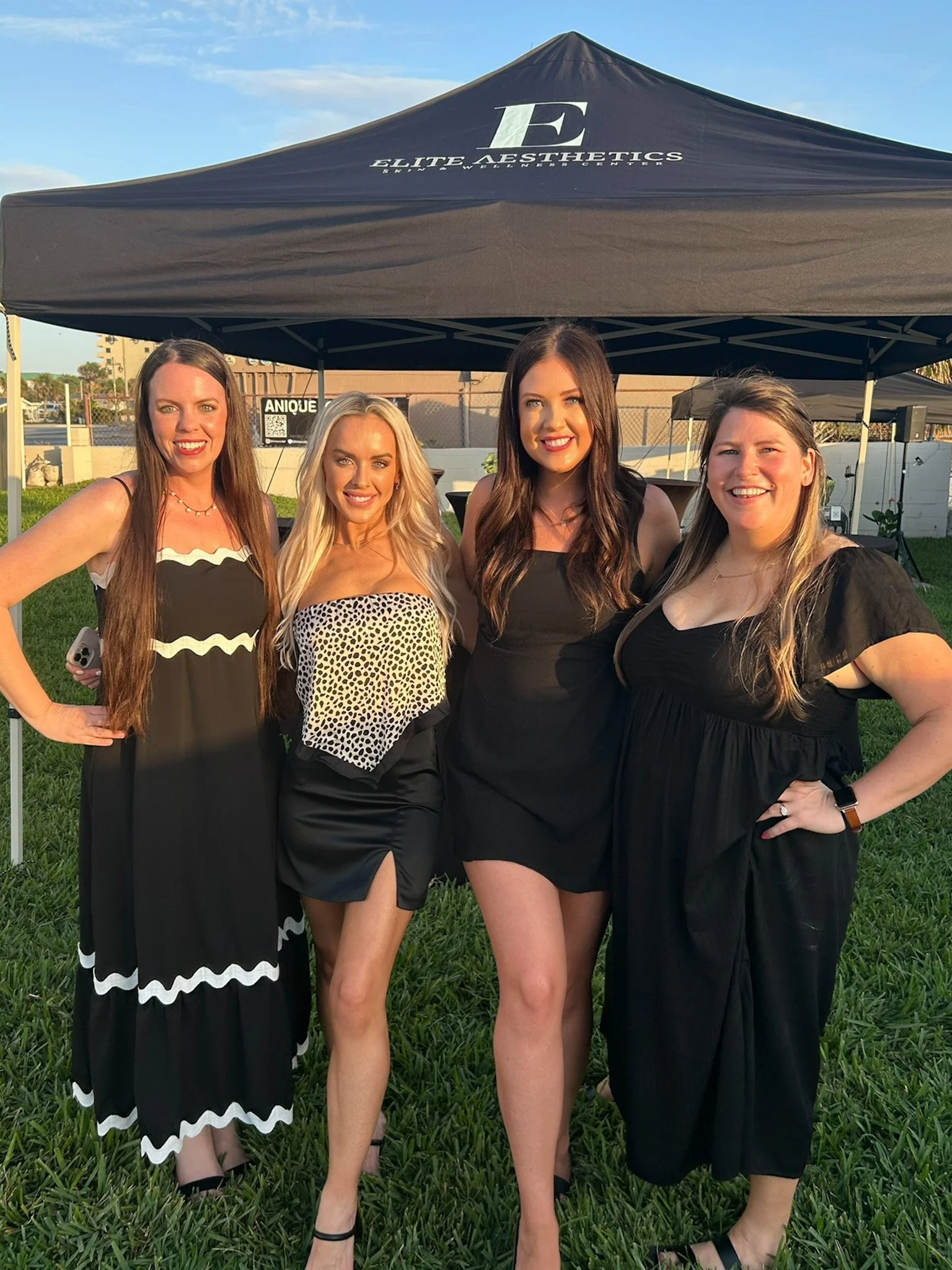 staff members of elite aesthetics smiling for a group picture