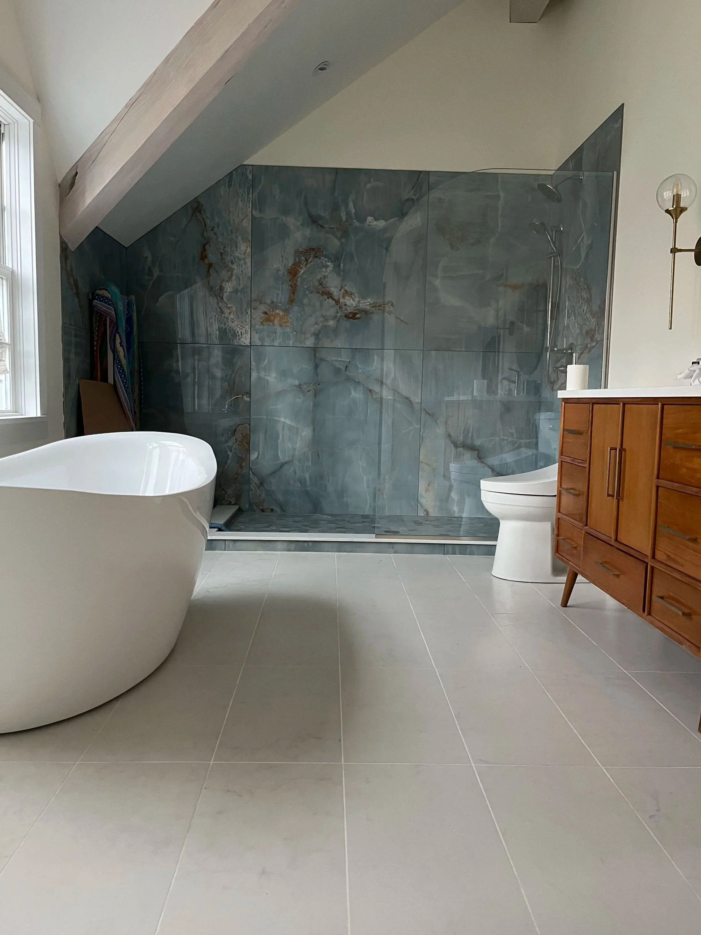 Stunning custom shower with hand built pan and imported tile