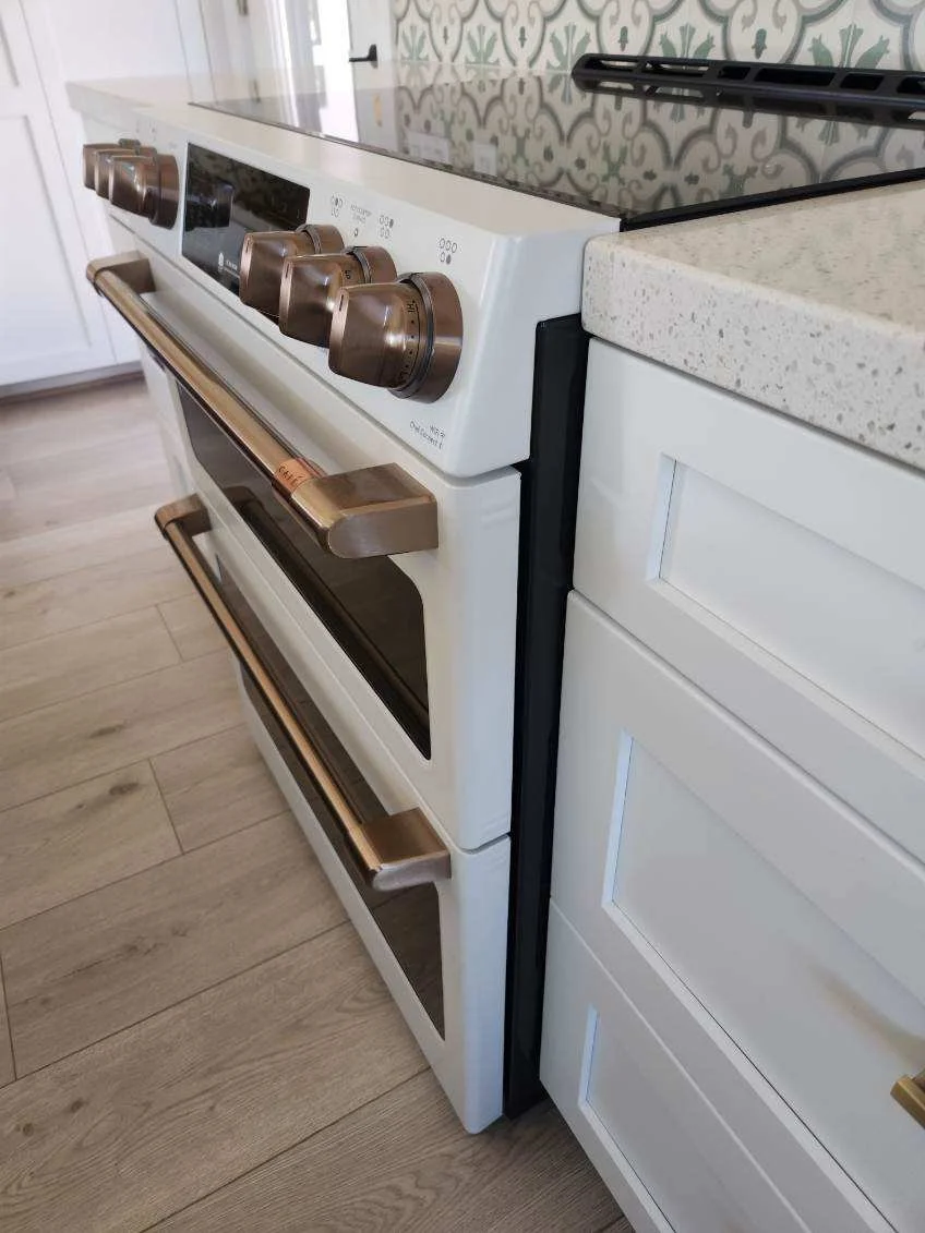 Modern White Range with Bronze Hardware