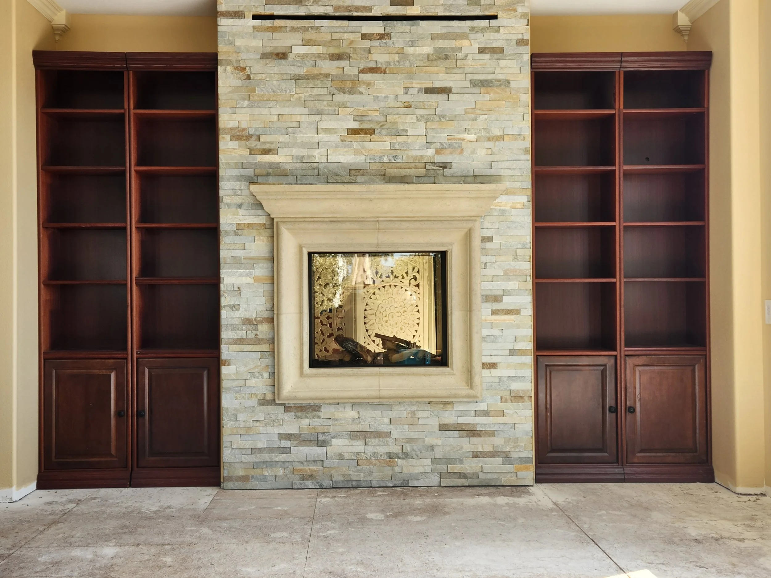 Fireplace remodel including installation of gas fireplace, stone, and new mantel. Installation of custom built-in cabinets. Remodel project took place in San Luis Obispo, CA.