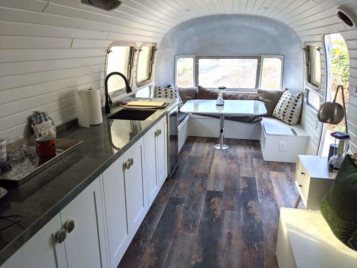 Custom Airstream Remodel. Airstream Renovation. Built in Kitchen, Dinning Nook