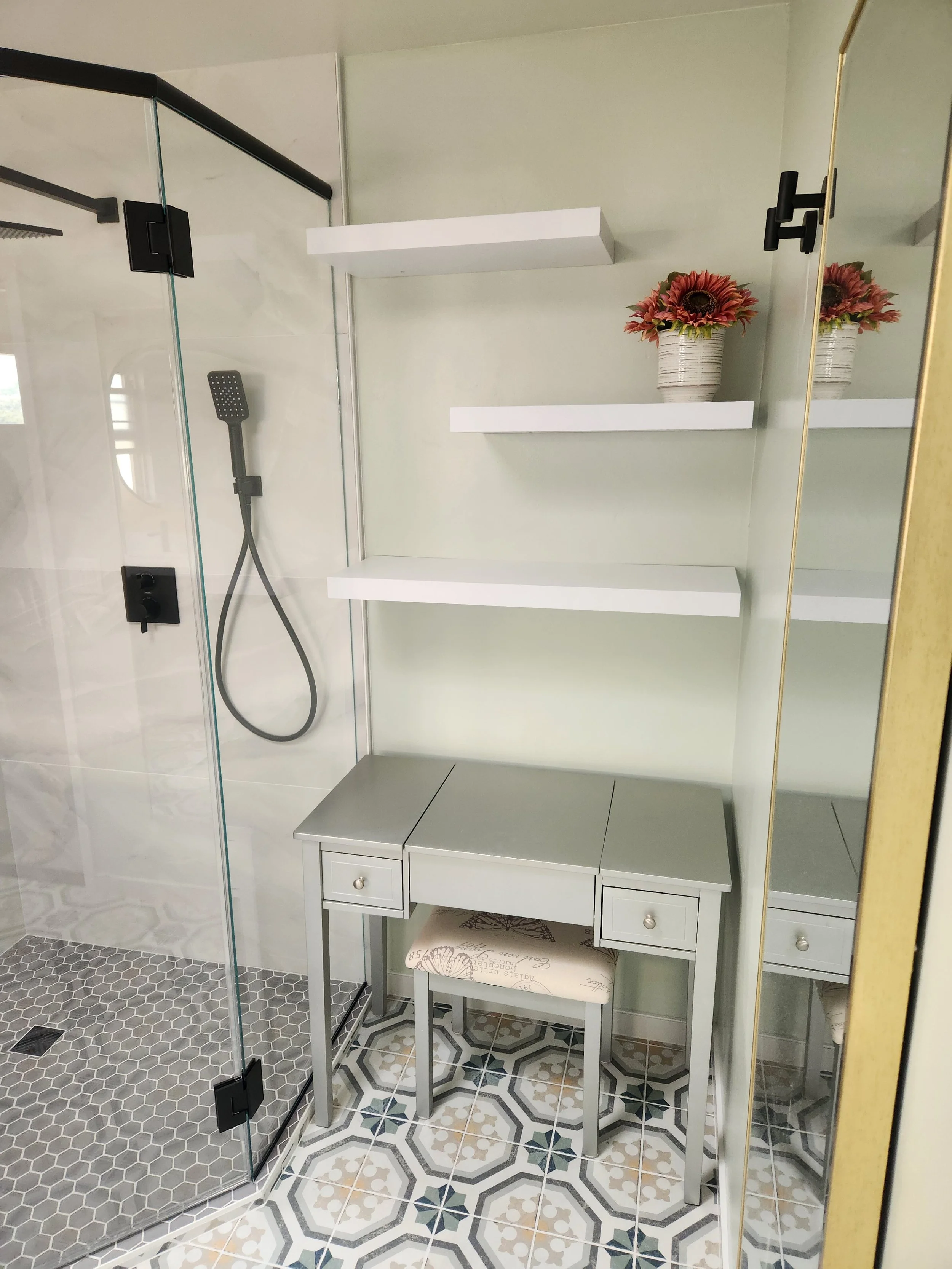 Bathroom remodel new tiled in shower with glass doors and floating storage shelves in San Luis Obispo county
