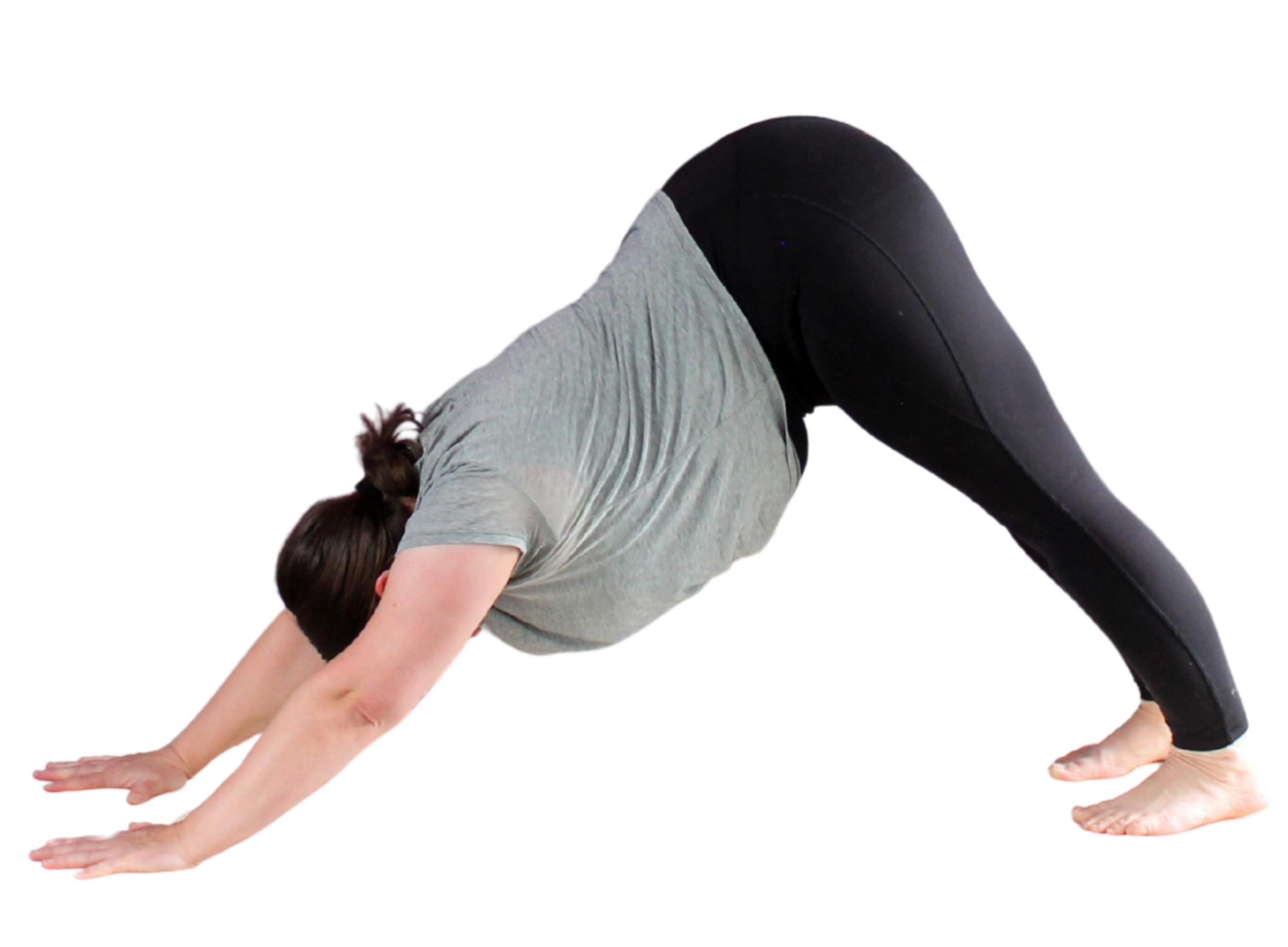 A person performing a yoga pose in downward dog position, on a black background.